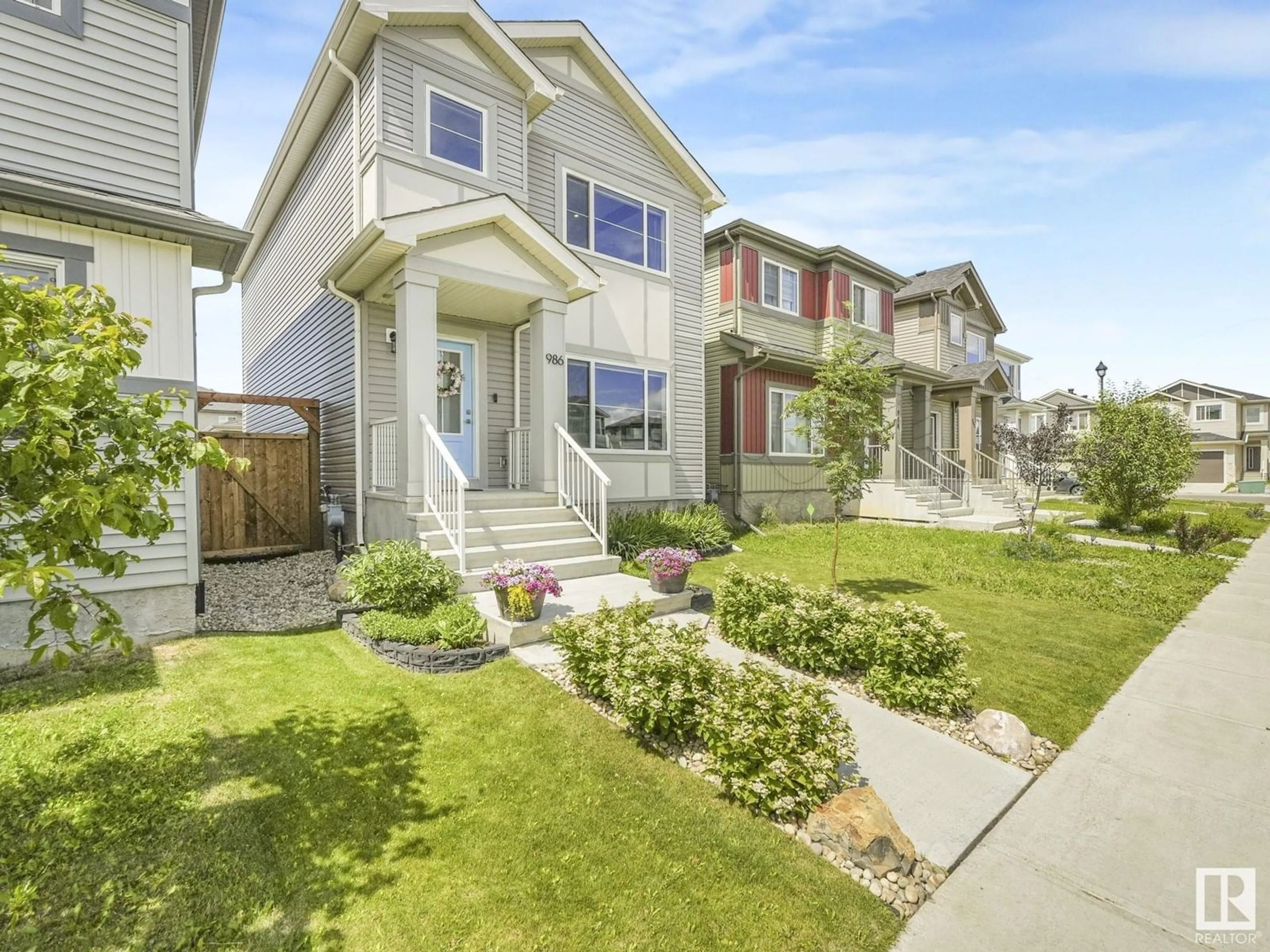 Home with vinyl exterior material, street for 986 BERG PL, Leduc Alberta T9E1L8