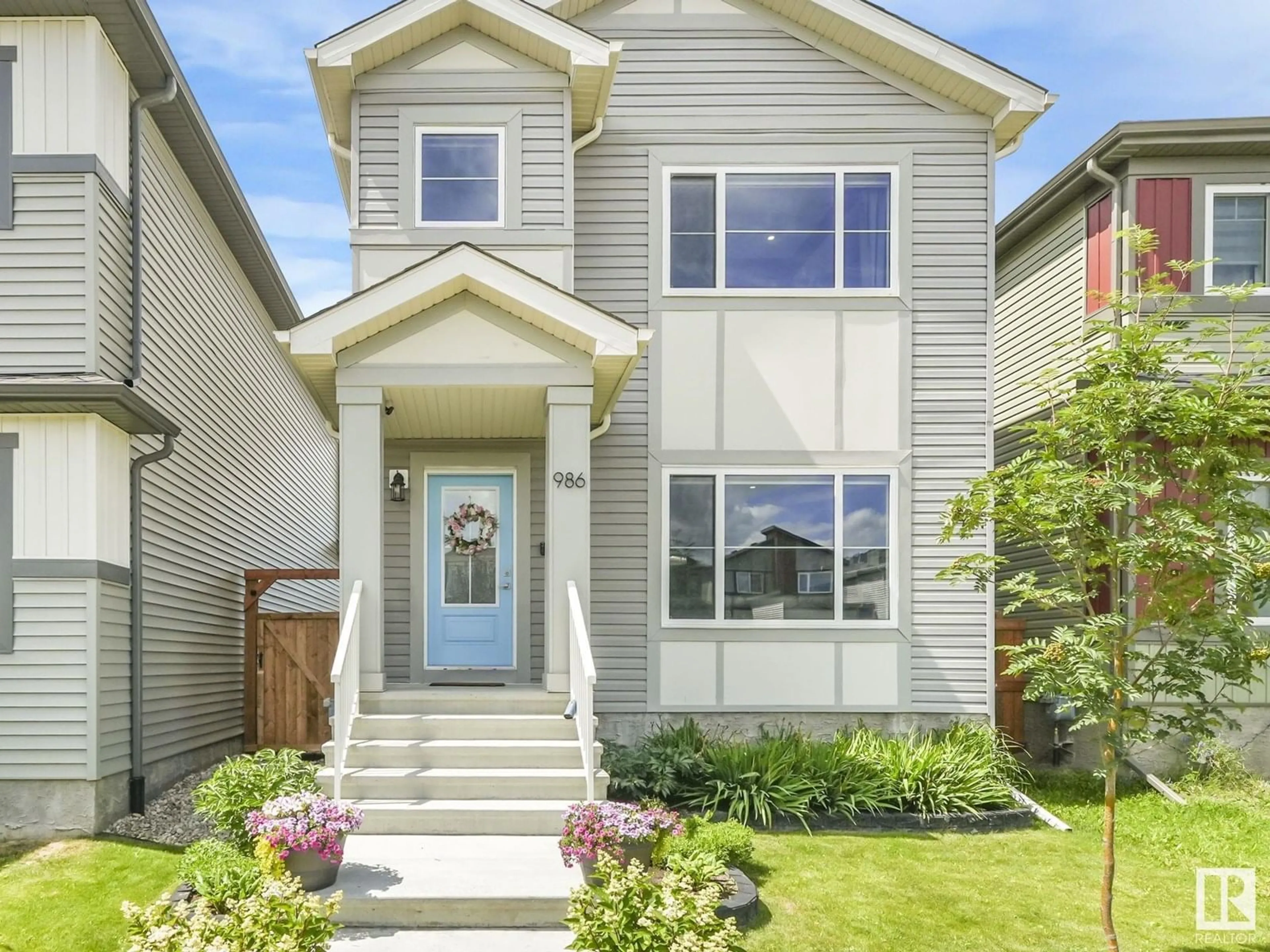 Home with vinyl exterior material, street for 986 BERG PL, Leduc Alberta T9E1L8