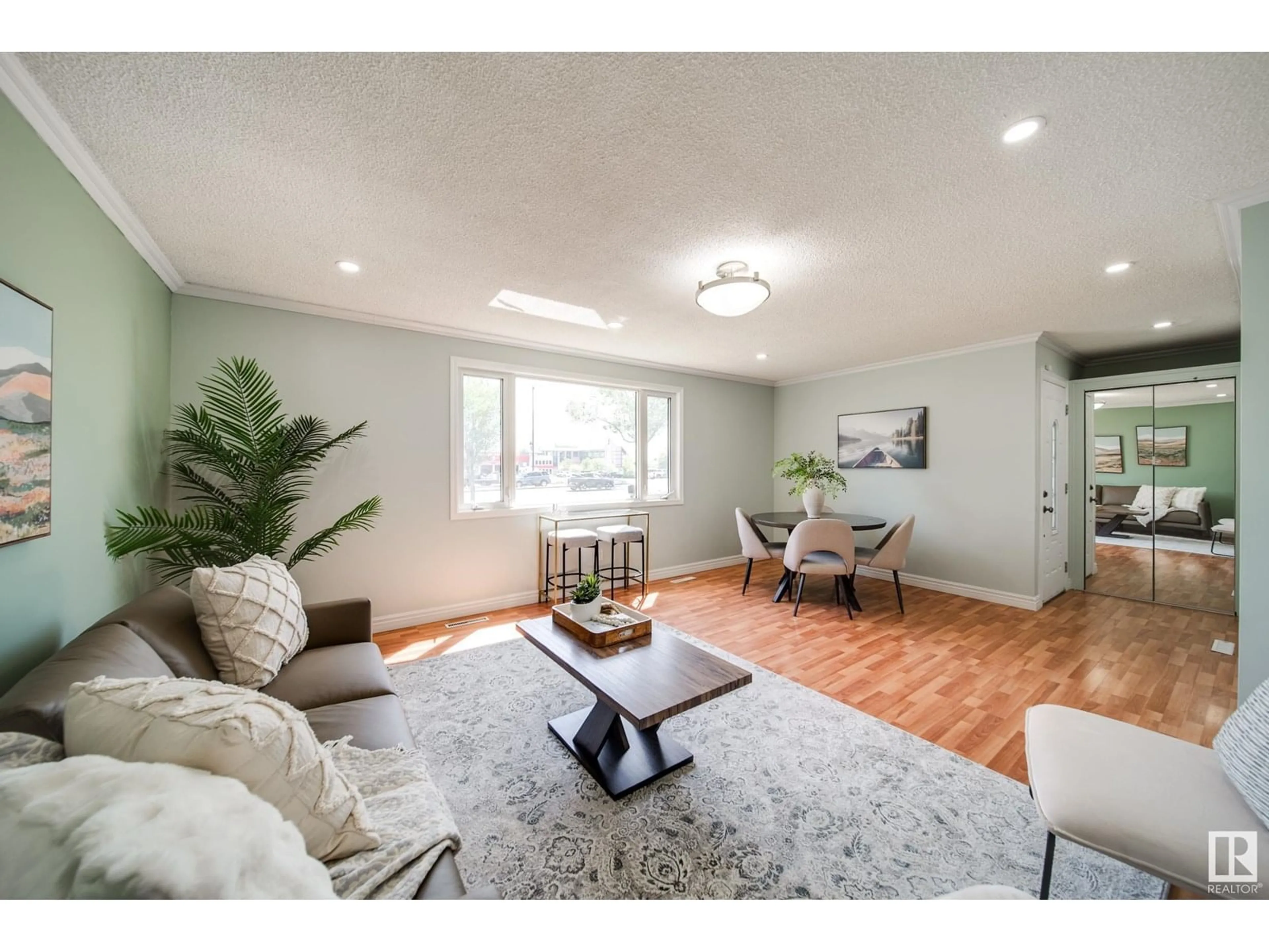 Living room with furniture, wood/laminate floor for 13004 FORT RD, Edmonton Alberta T5A1B8