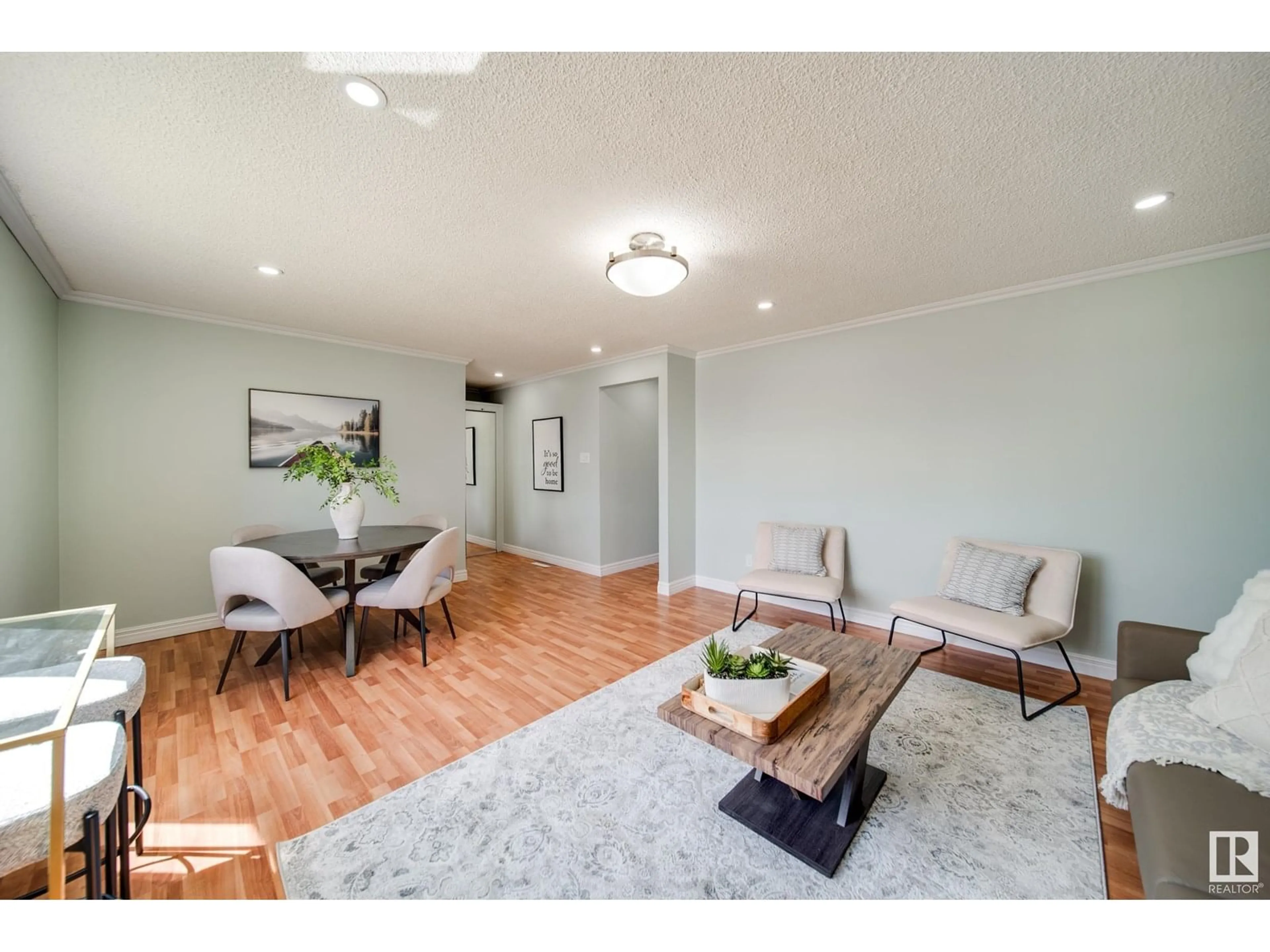 Living room with furniture, wood/laminate floor for 13004 FORT RD, Edmonton Alberta T5A1B8