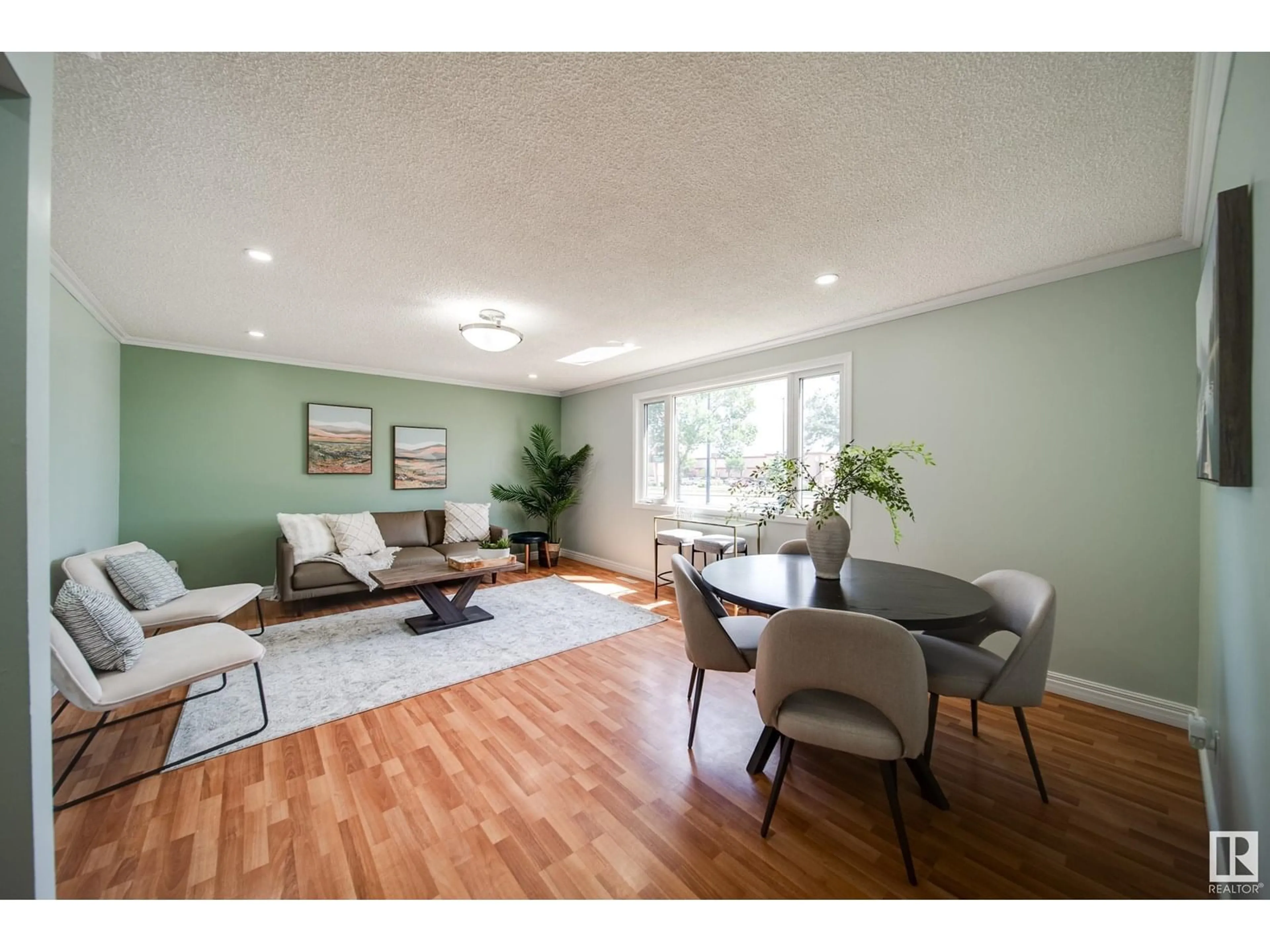 Living room with furniture, wood/laminate floor for 13004 FORT RD, Edmonton Alberta T5A1B8