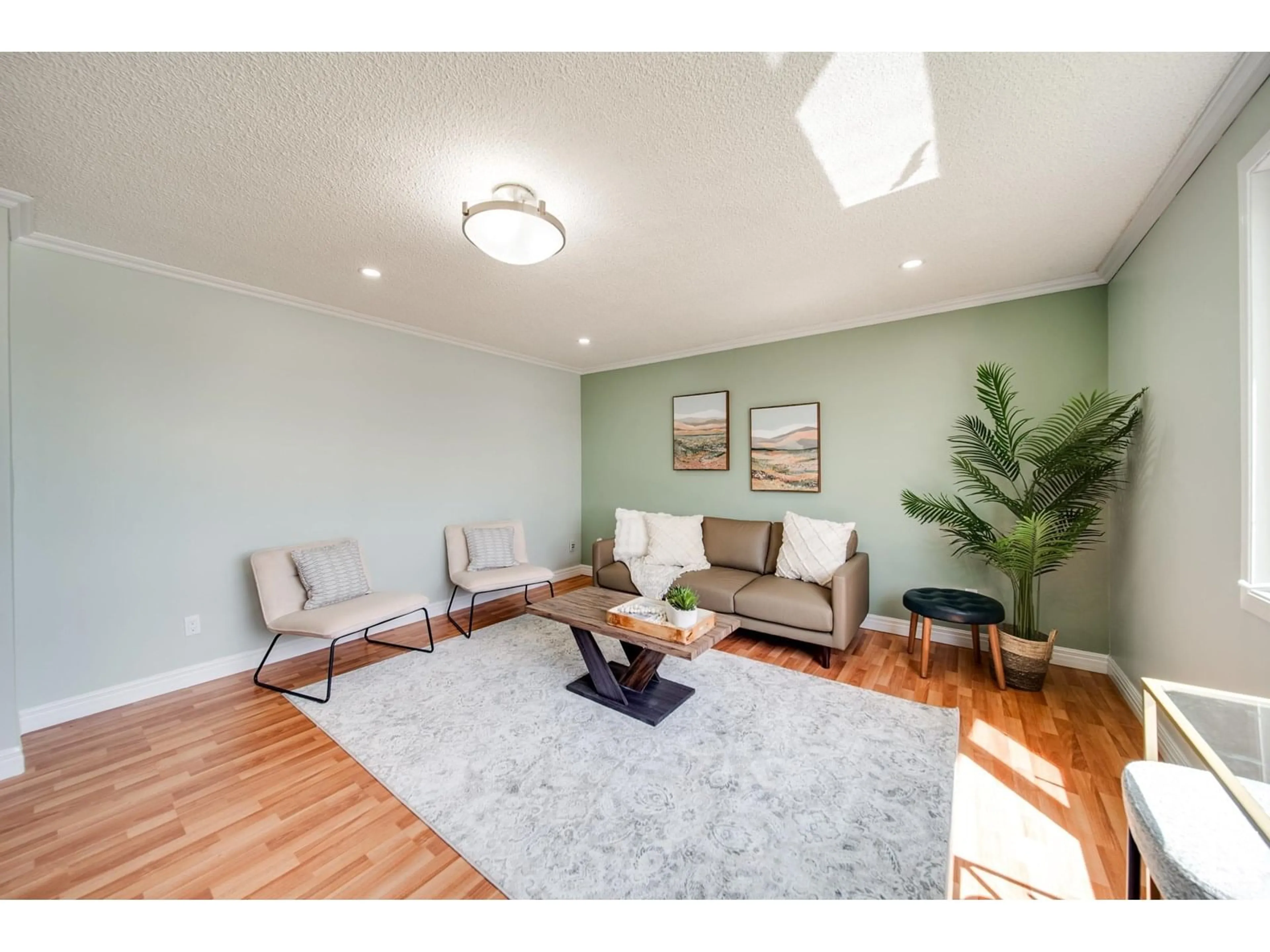 Living room with furniture, wood/laminate floor for 13004 FORT RD, Edmonton Alberta T5A1B8