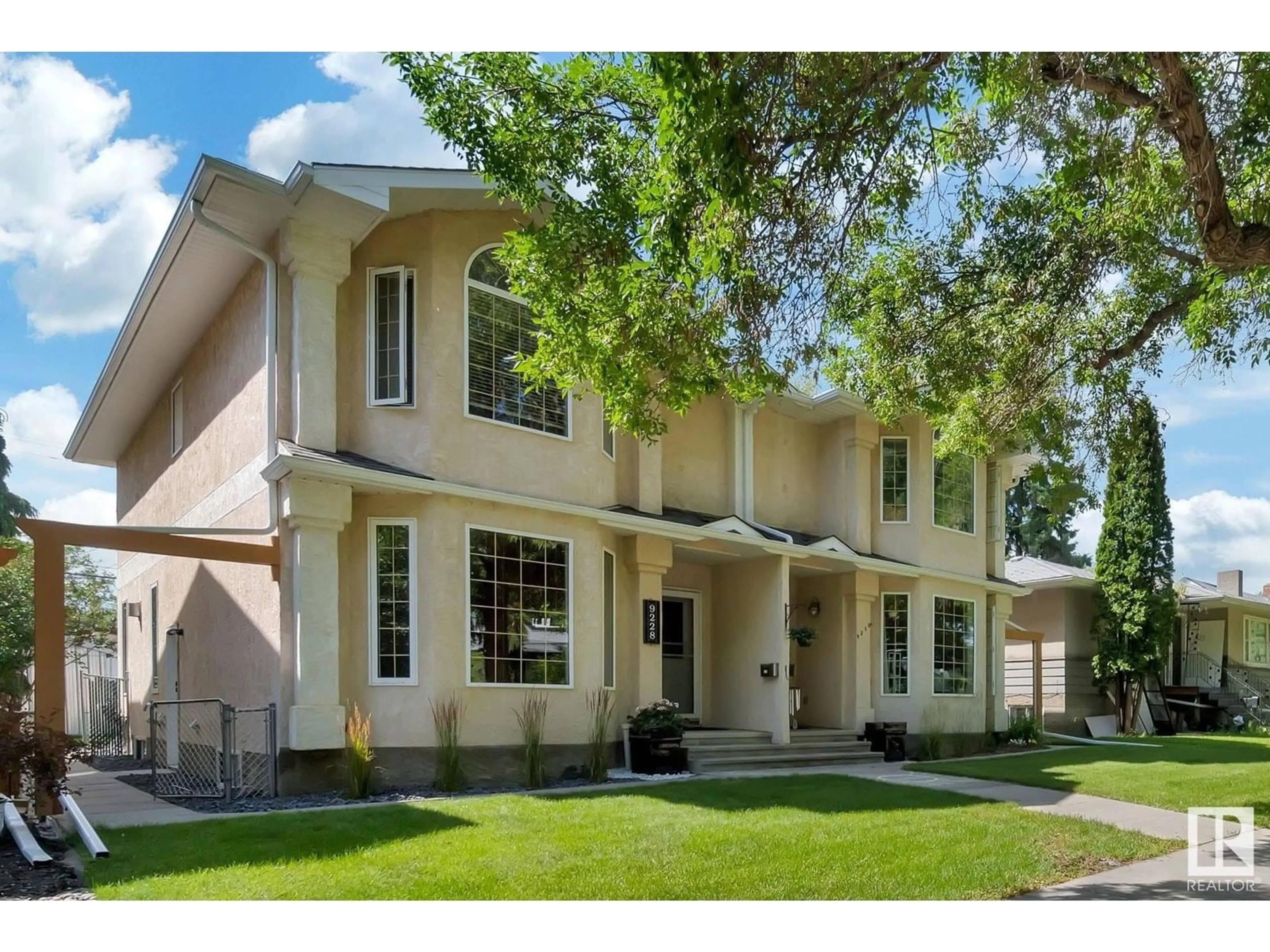 Home with vinyl exterior material, street for NW - 9228 92 ST, Edmonton Alberta T6C3R5