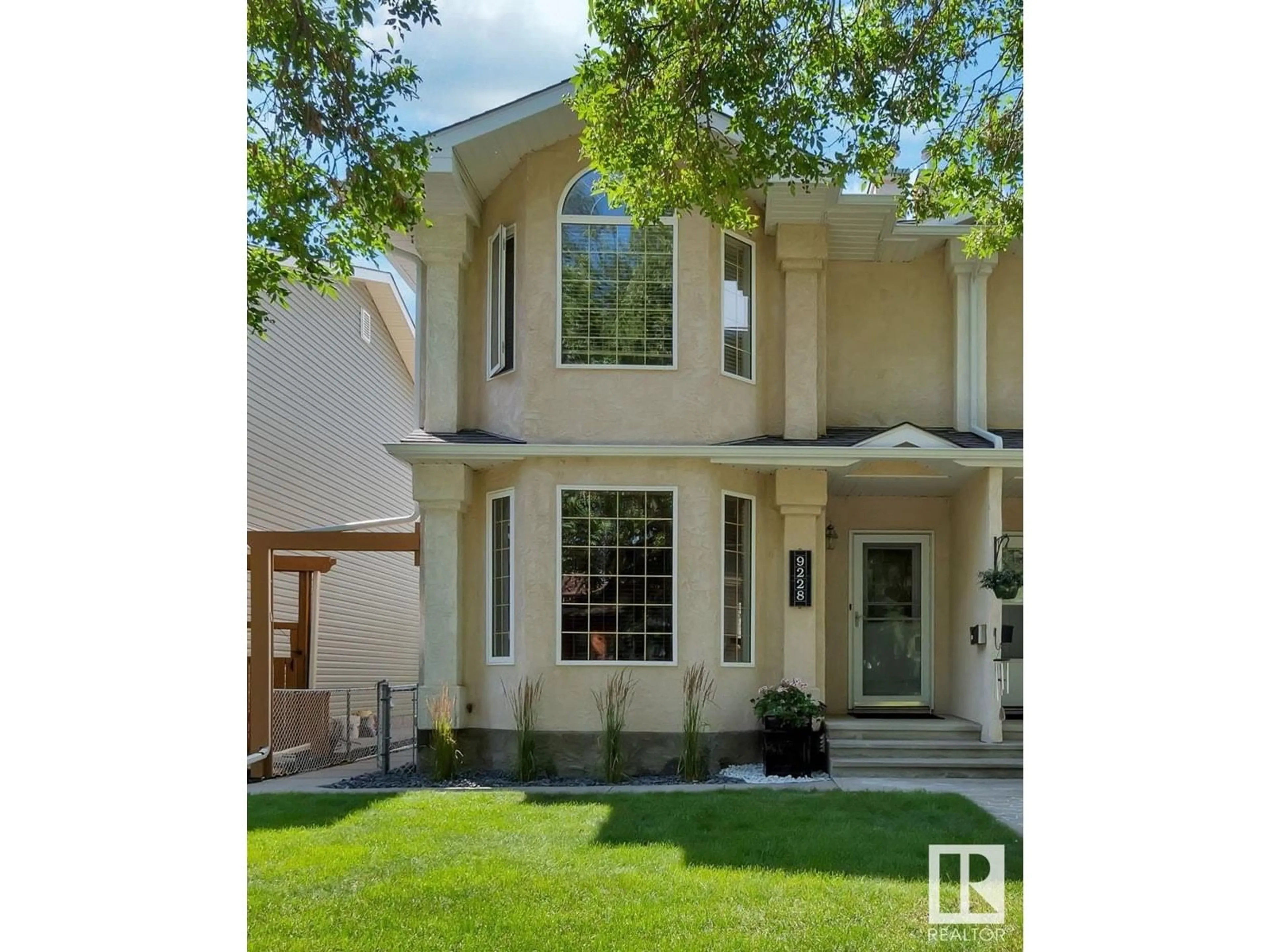 Home with vinyl exterior material, street for NW - 9228 92 ST, Edmonton Alberta T6C3R5