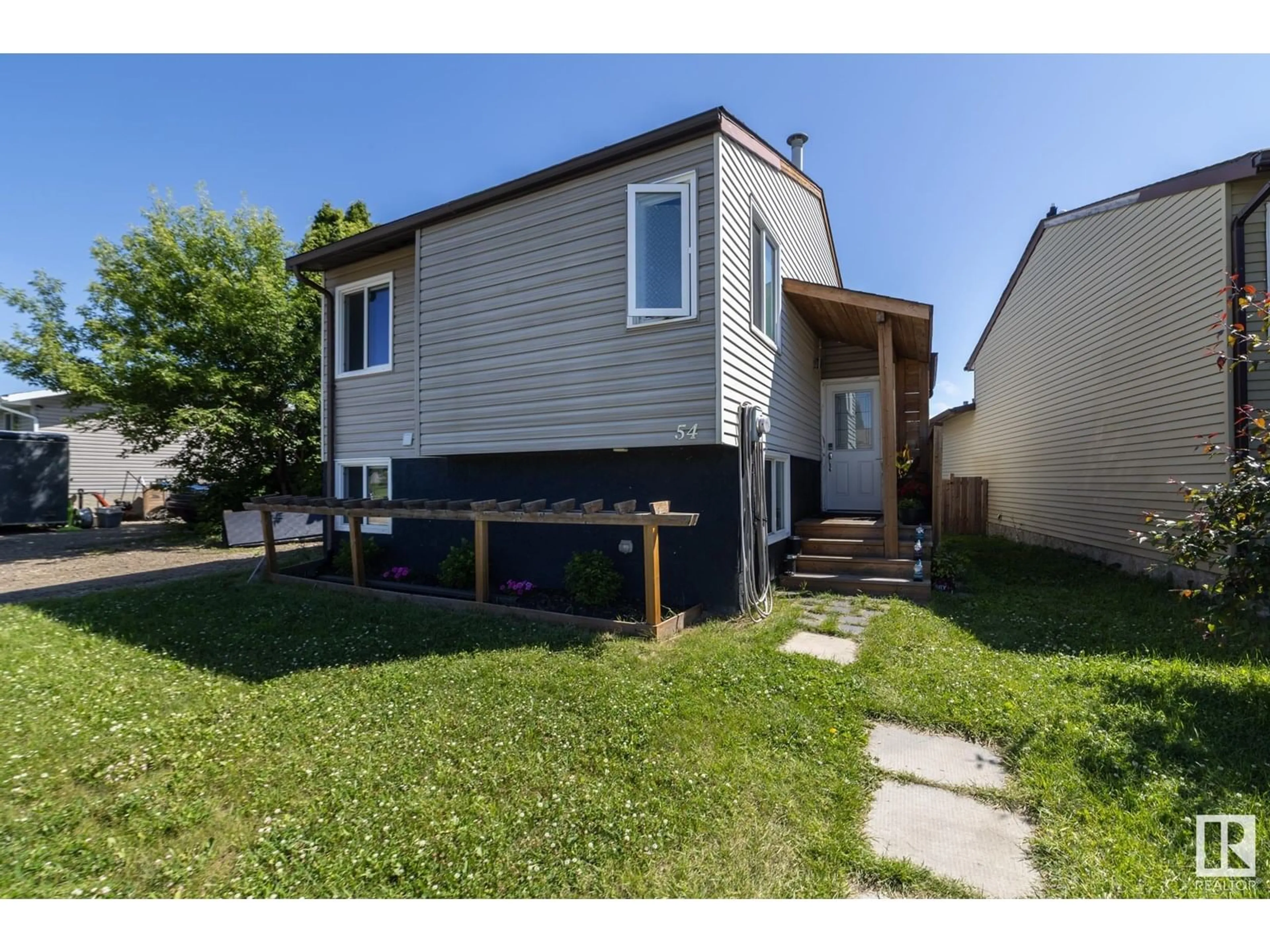 Home with vinyl exterior material, street for 54 PIPESTONE DR, Devon Alberta T9G1T3