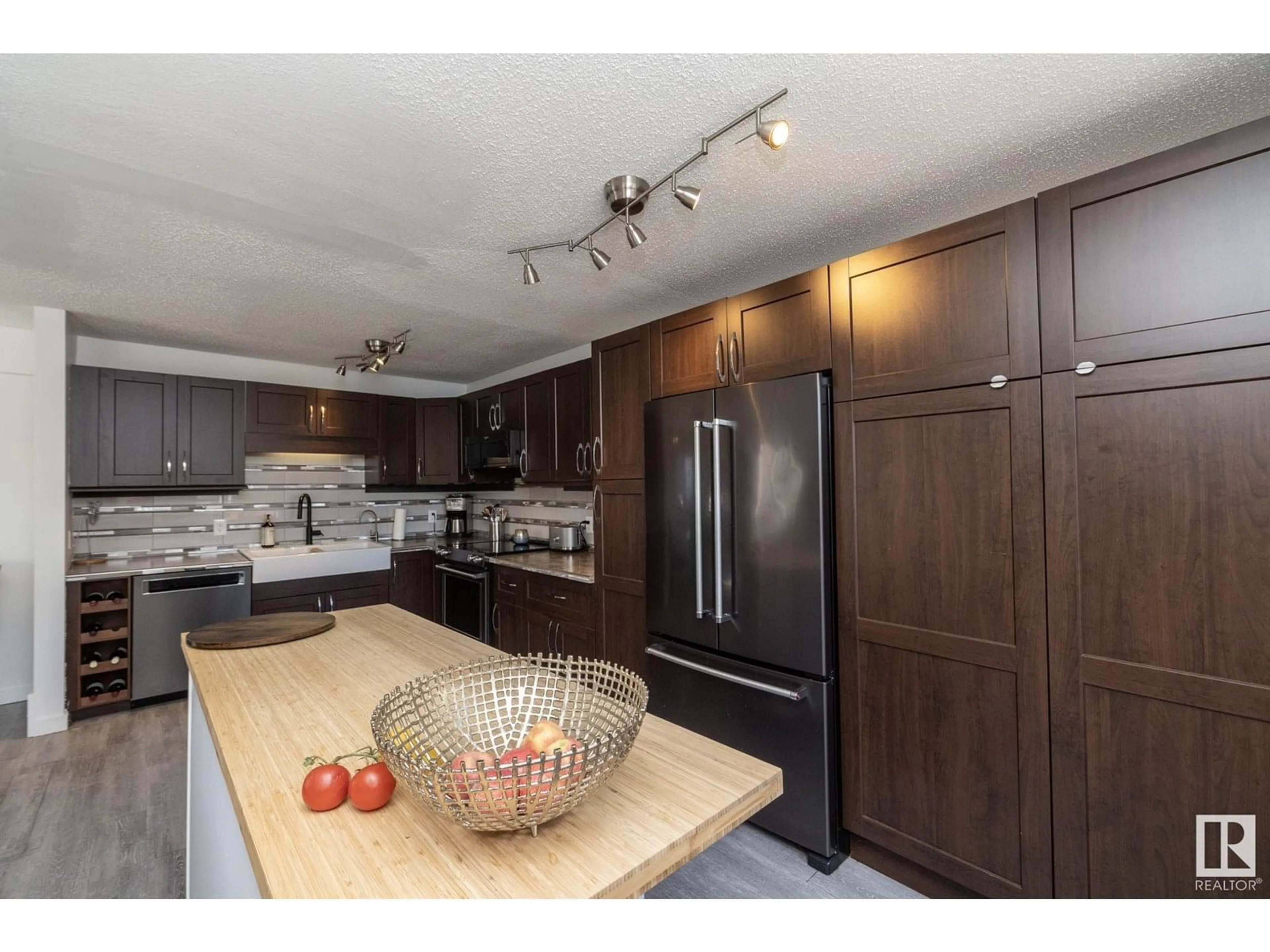 Open concept kitchen, wood/laminate floor for 54 PIPESTONE DR, Devon Alberta T9G1T3