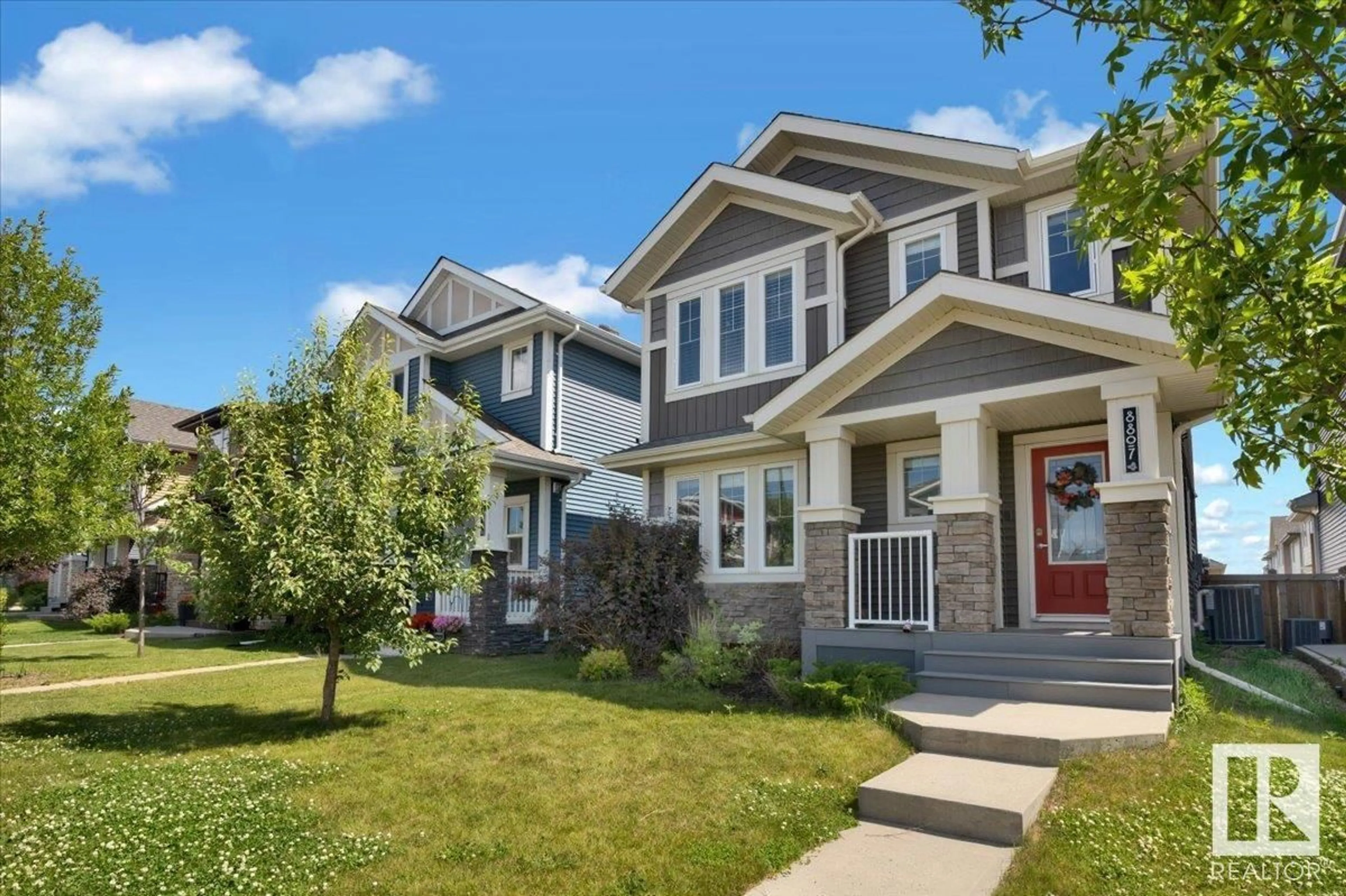 Home with vinyl exterior material, street for NW - 8807 223 ST, Edmonton Alberta T5T7H2