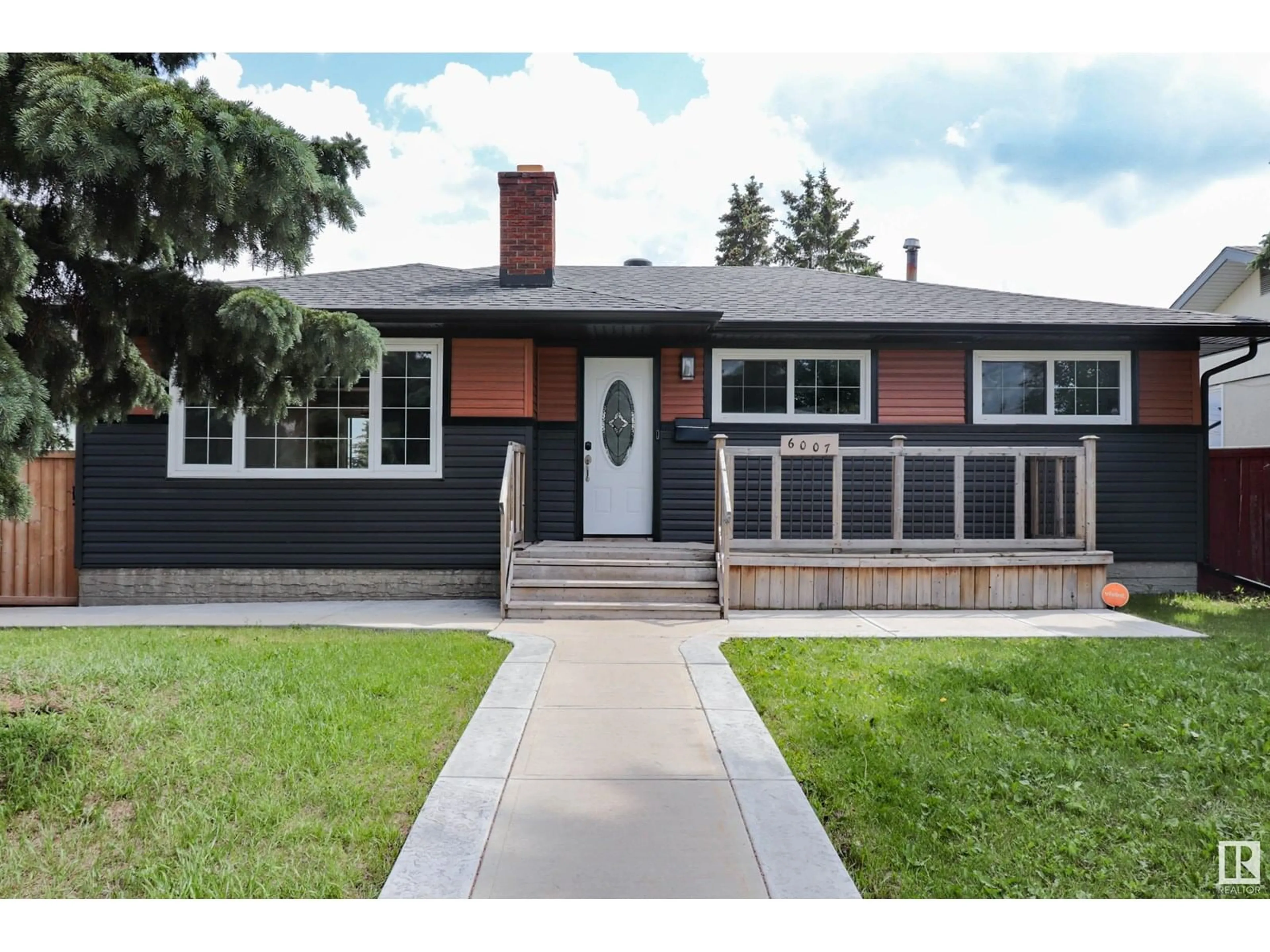 Home with vinyl exterior material, street for 6007 141 AV, Edmonton Alberta T5A1H9