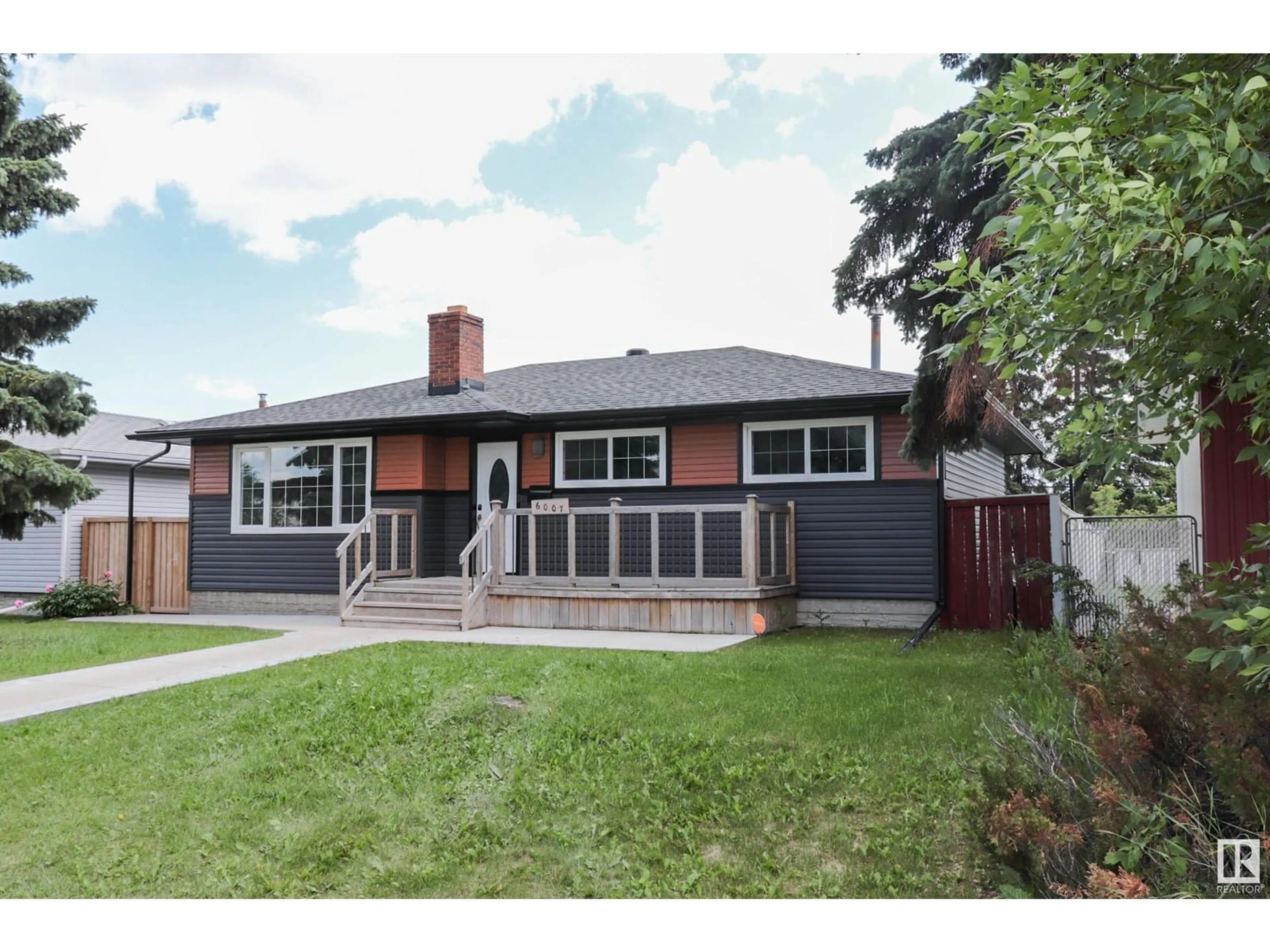 Home with vinyl exterior material, street for 6007 141 AV, Edmonton Alberta T5A1H9