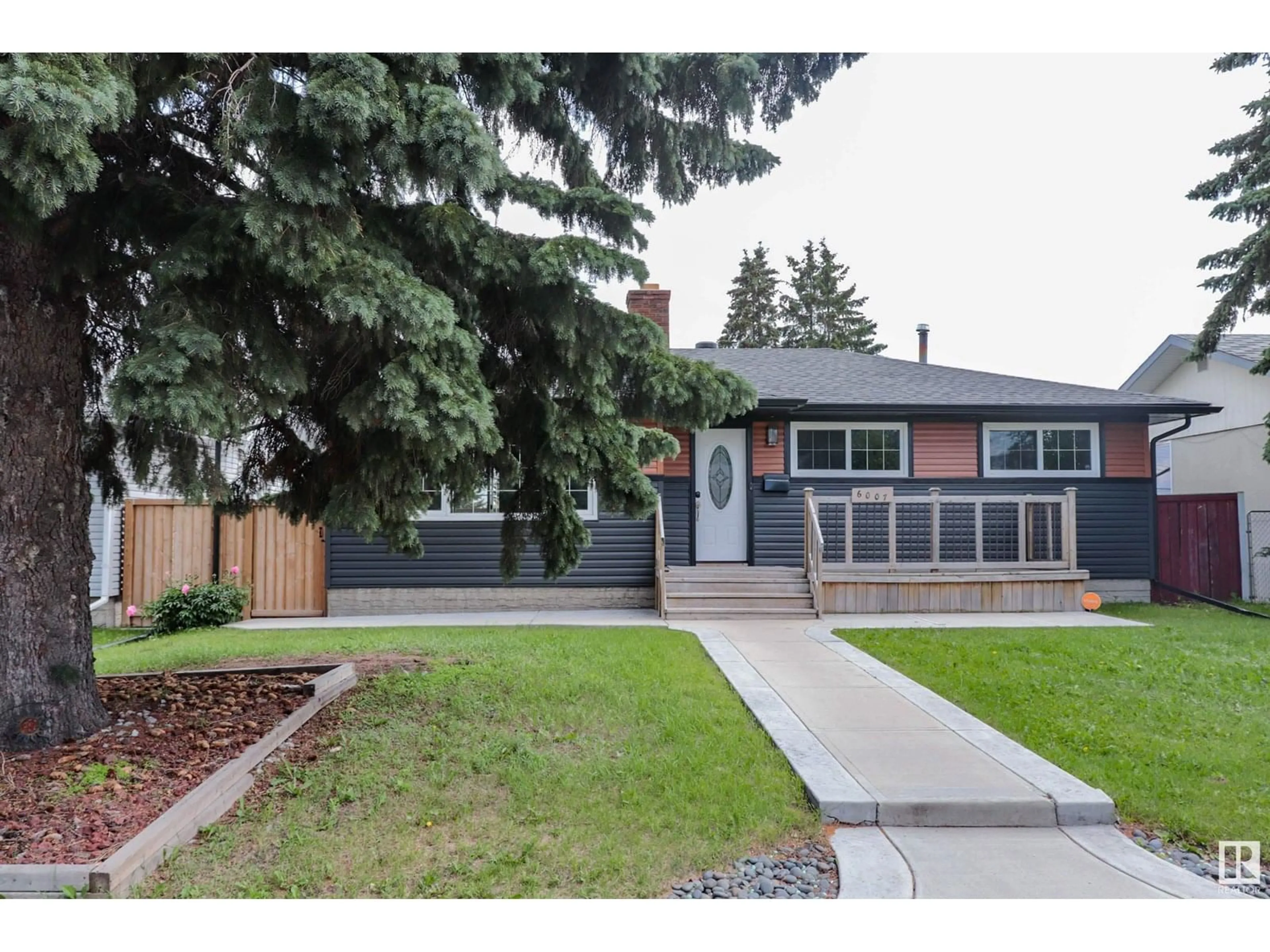 Home with brick exterior material, street for 6007 141 AV, Edmonton Alberta T5A1H9