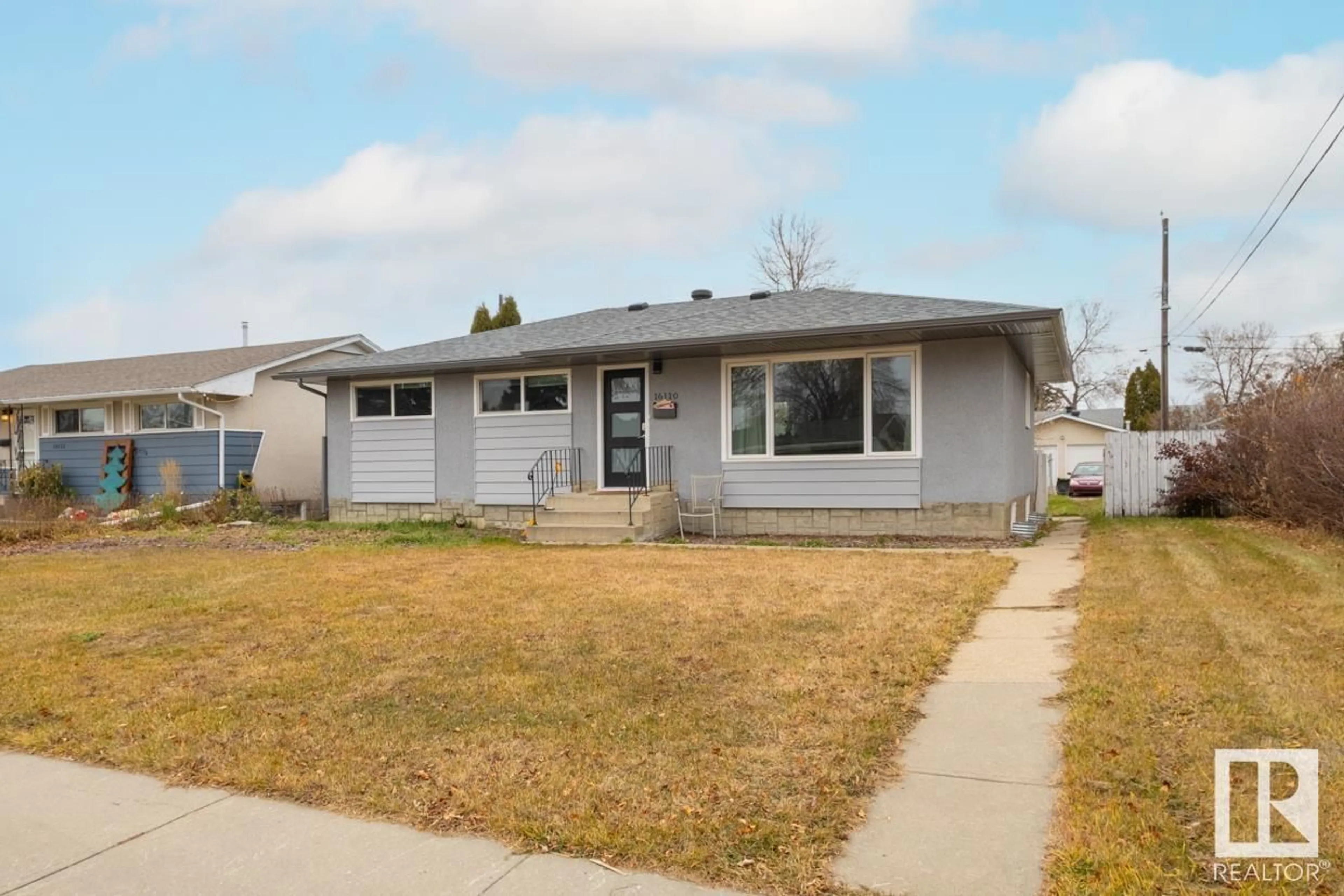 Home with vinyl exterior material, street for 16110 82 AV, Edmonton Alberta T5R3S4