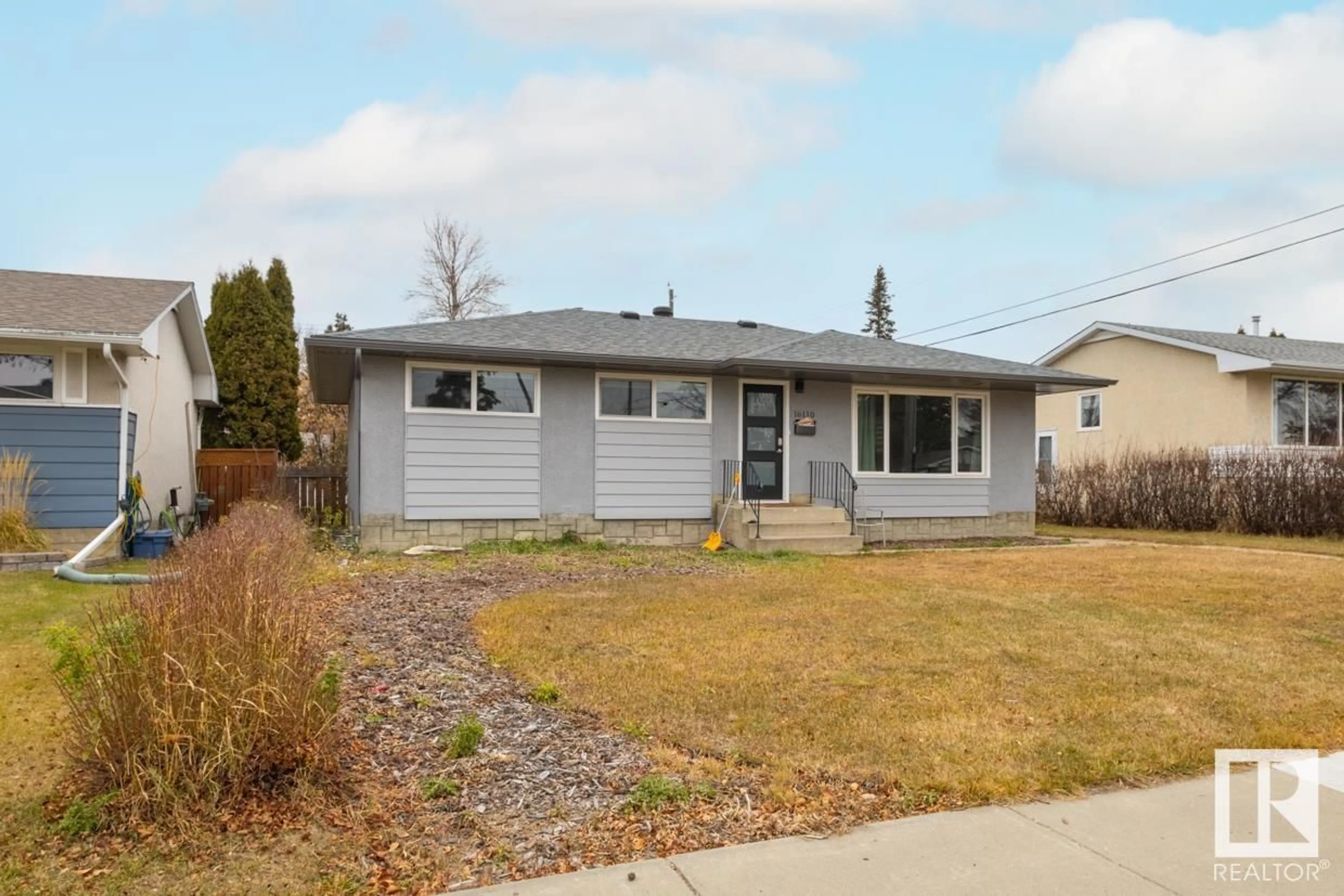 Home with vinyl exterior material, street for 16110 82 AV, Edmonton Alberta T5R3S4