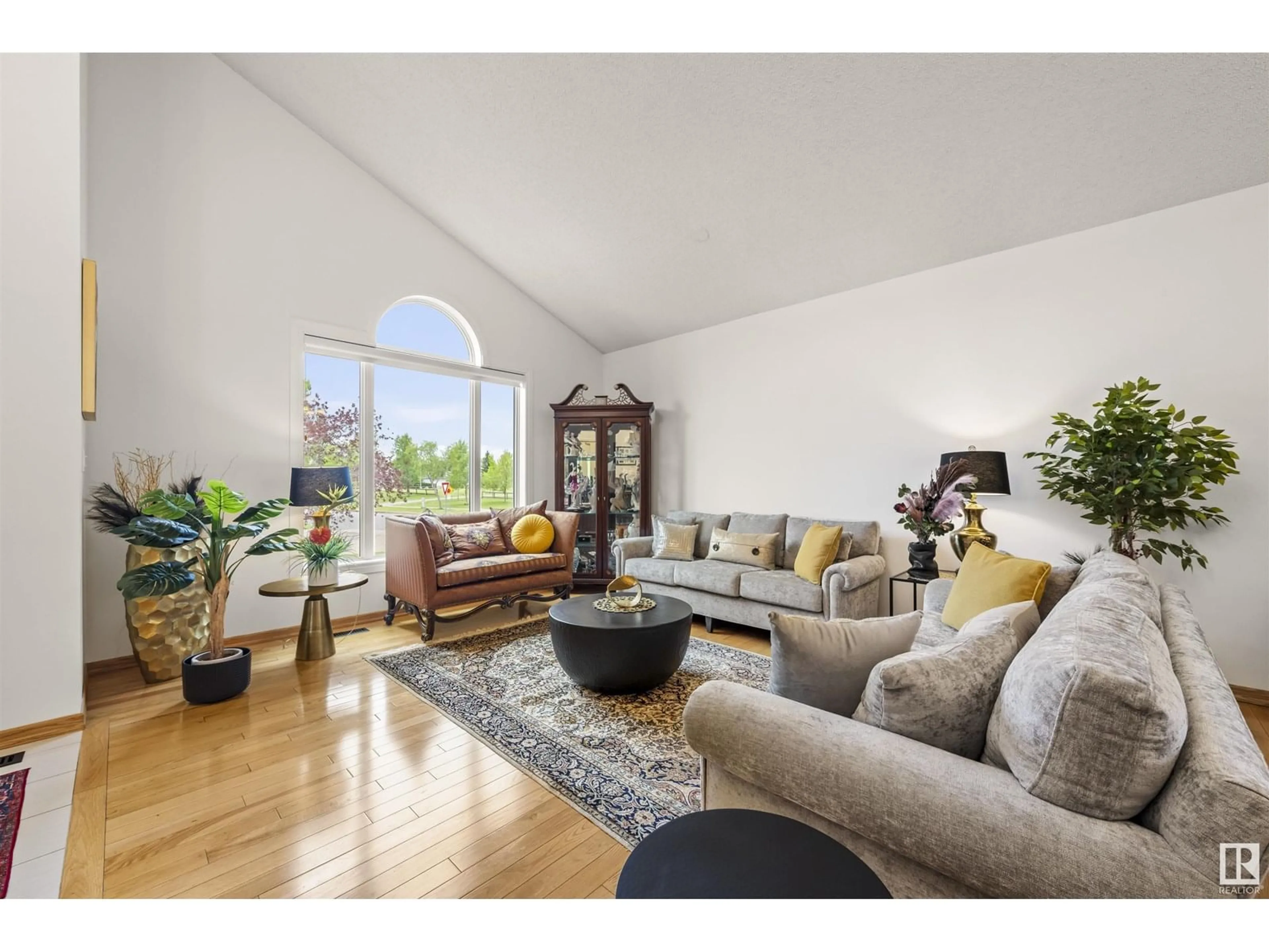 Living room with furniture, wood/laminate floor for 299 BULYEA RD, Edmonton Alberta T6R1R8