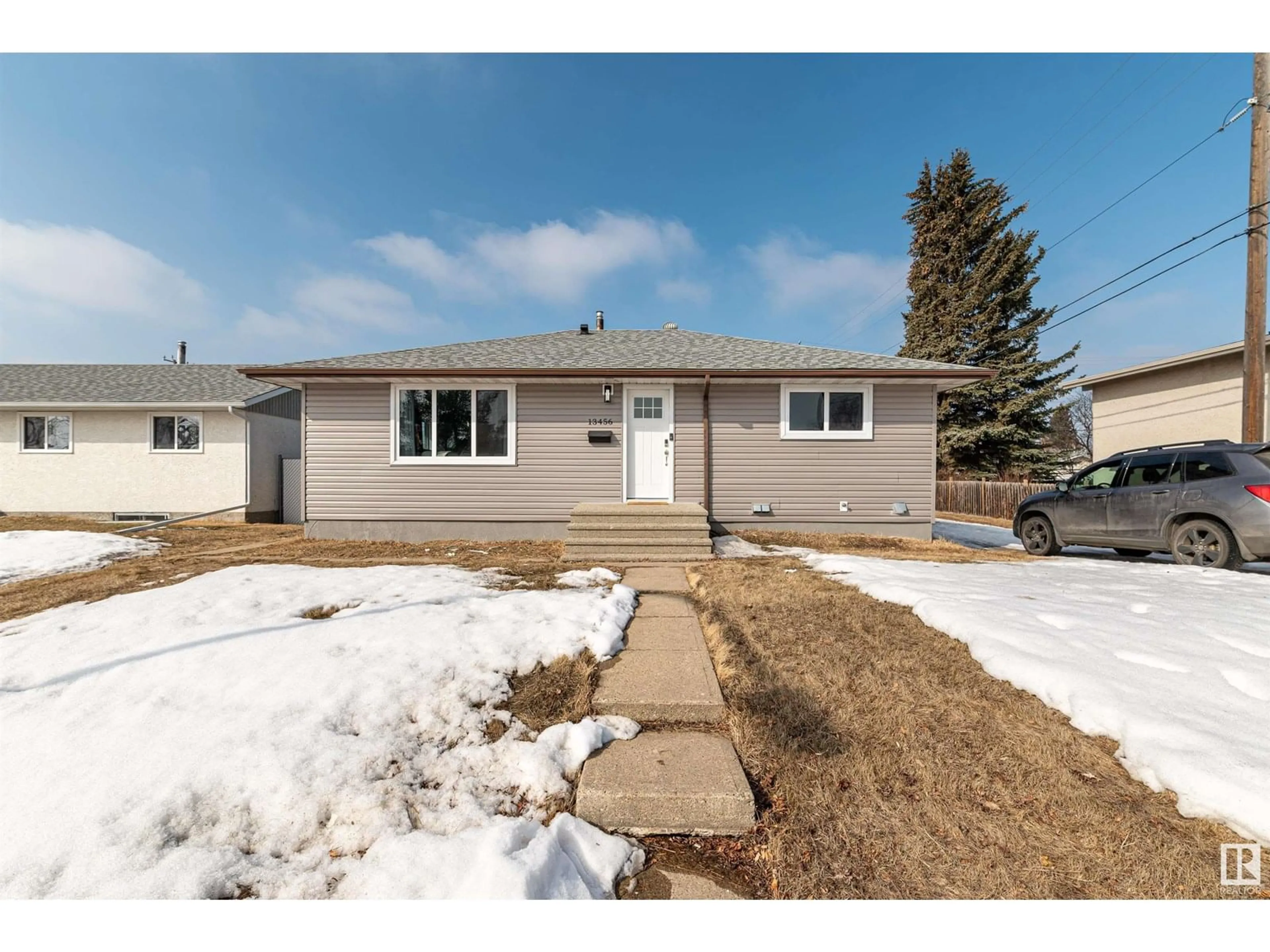 Home with vinyl exterior material, street for NW - 13456 107 ST, Edmonton Alberta T5E4W2
