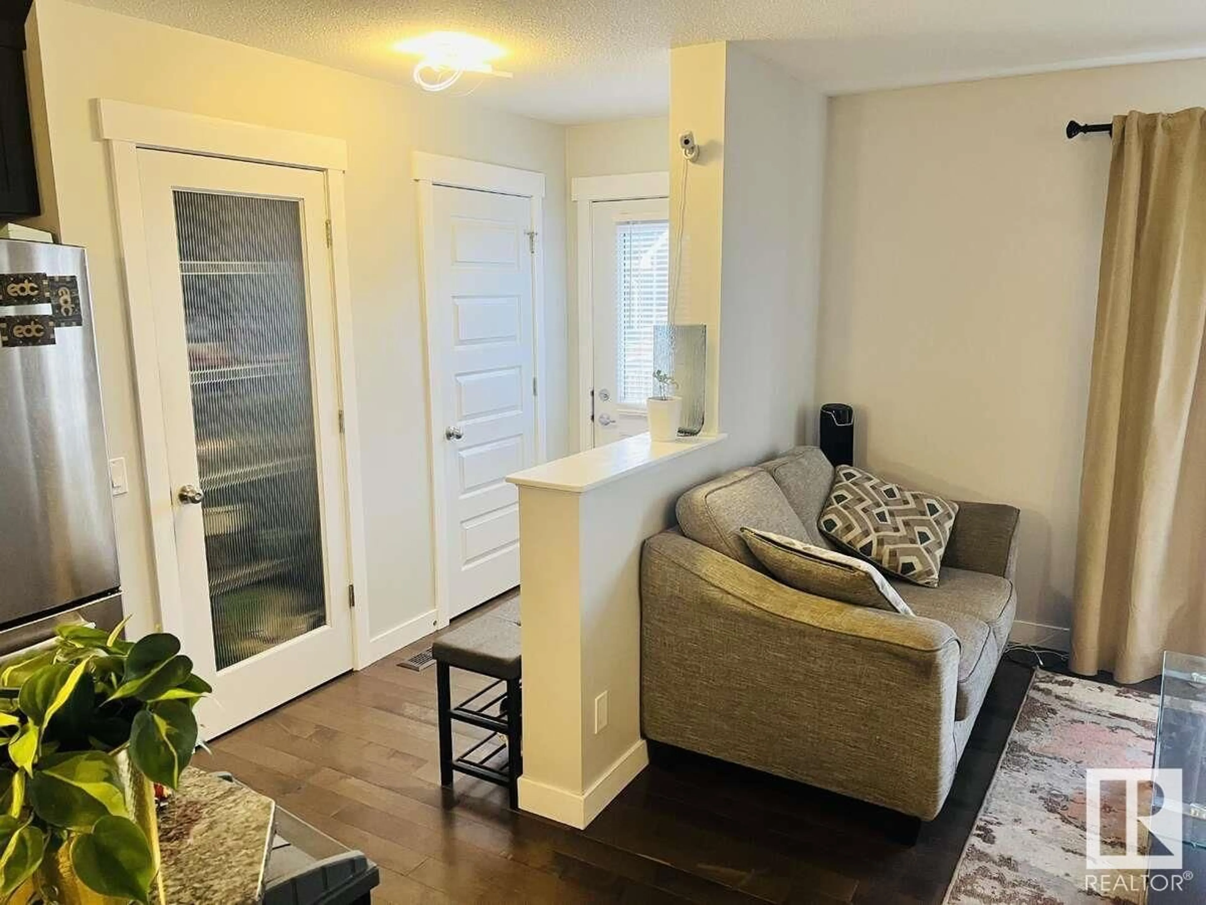 Living room with furniture, wood/laminate floor for 6 ABBEY RD, Sherwood Park Alberta T8H0V6
