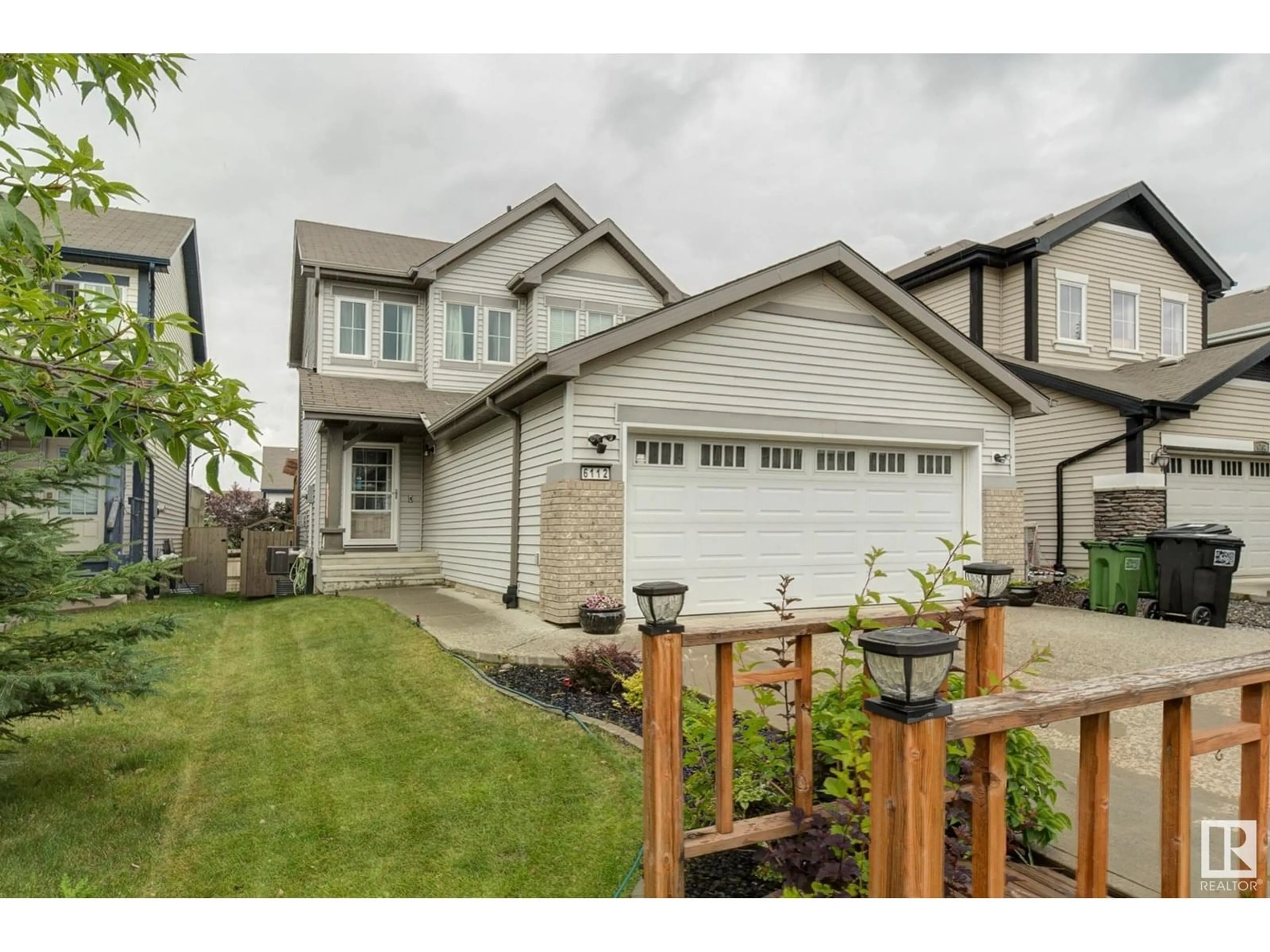 Home with vinyl exterior material, street for SW - 6112 11 AV, Edmonton Alberta T6X0M4