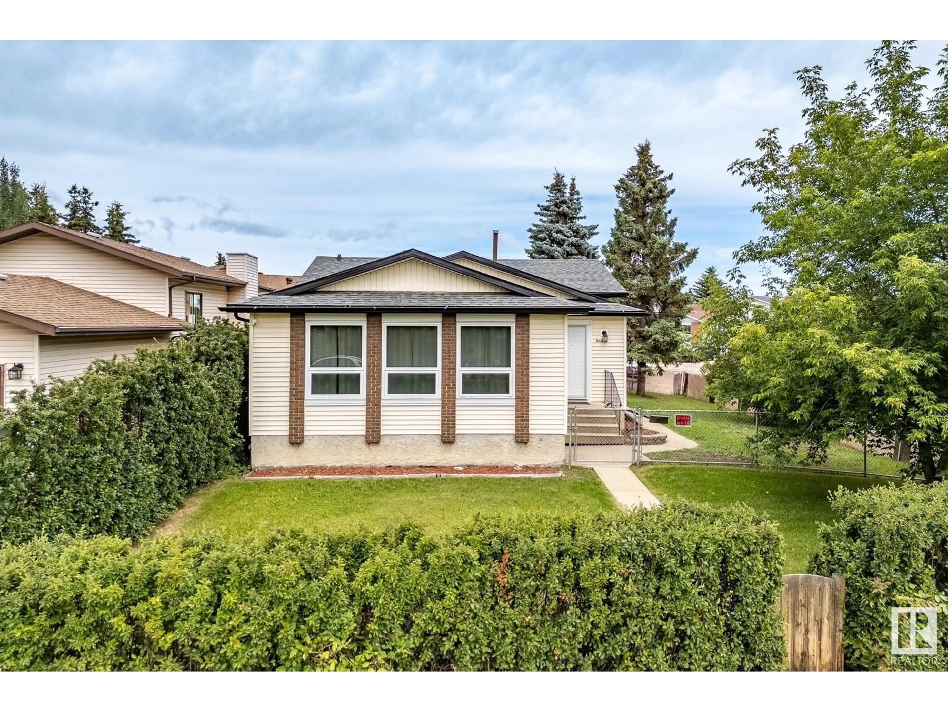 Home with vinyl exterior material, street for 16352 119 ST, Edmonton Alberta T5X4T5