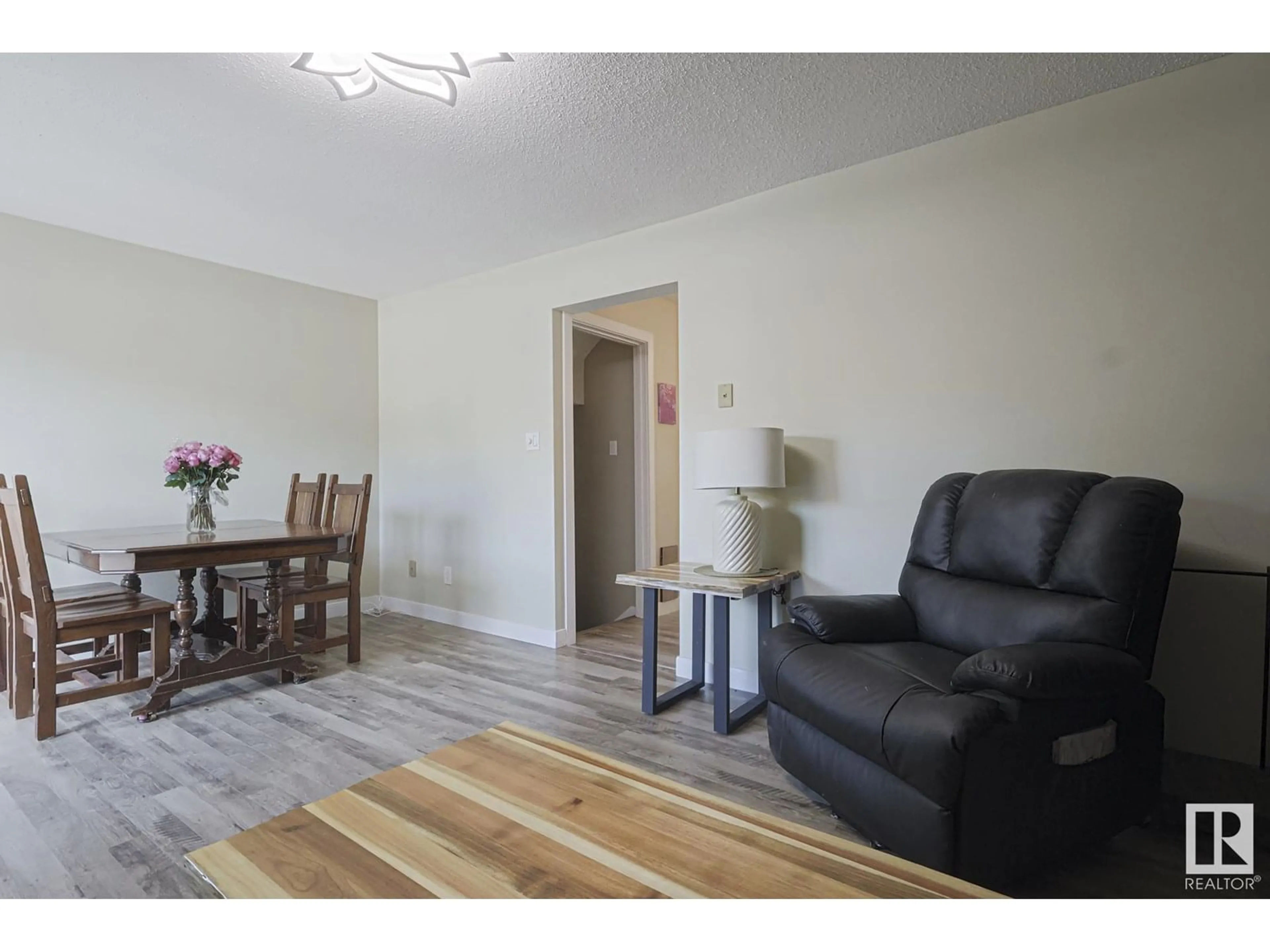 Living room with furniture, wood/laminate floor for 12056 25 AV, Edmonton Alberta T6J4L3