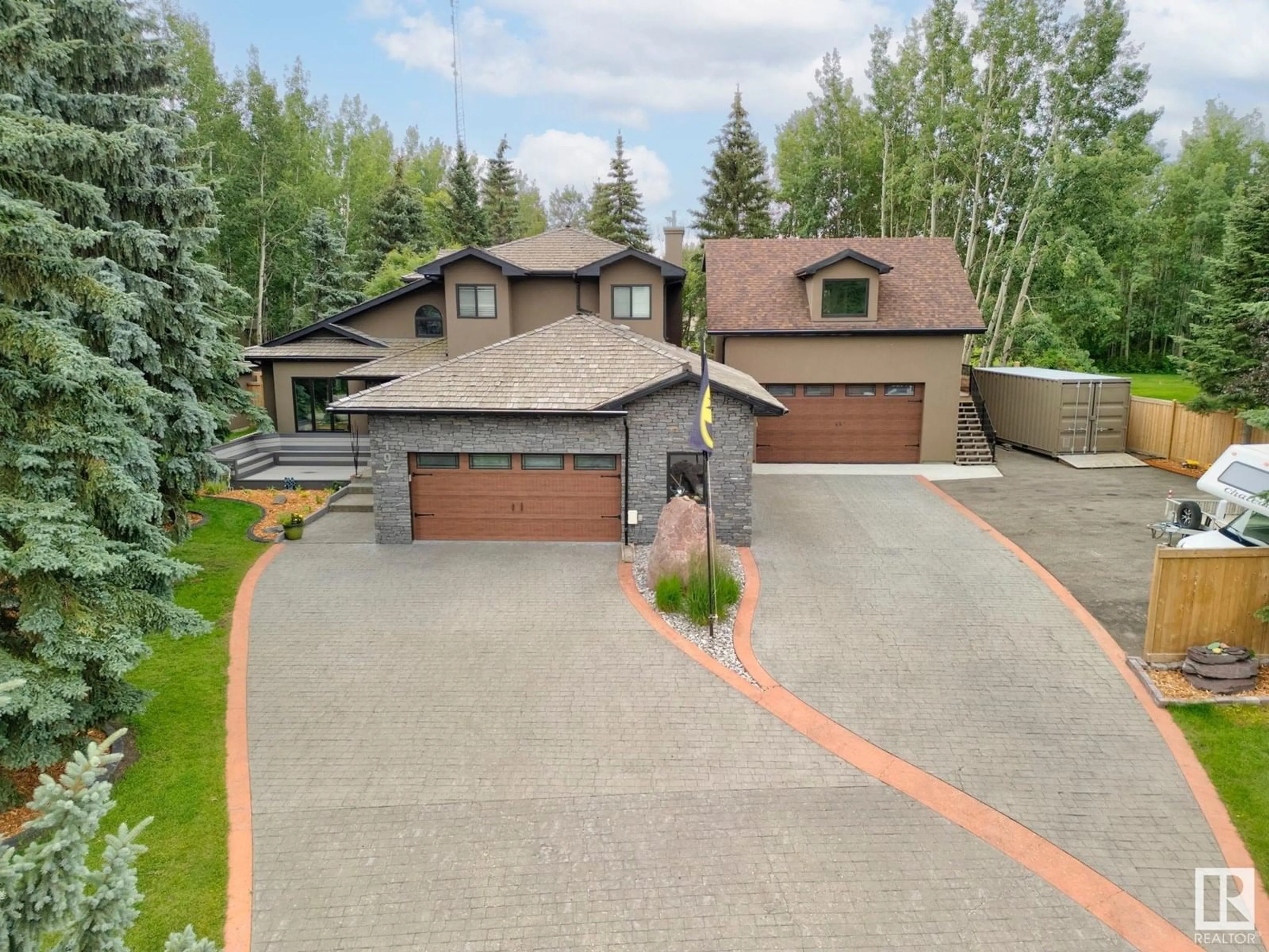 A pic from outside/outdoor area/front of a property/back of a property/a pic from drone, street for 53226 - 107 RGE ROAD 261, Rural Parkland County Alberta T7Y1A3