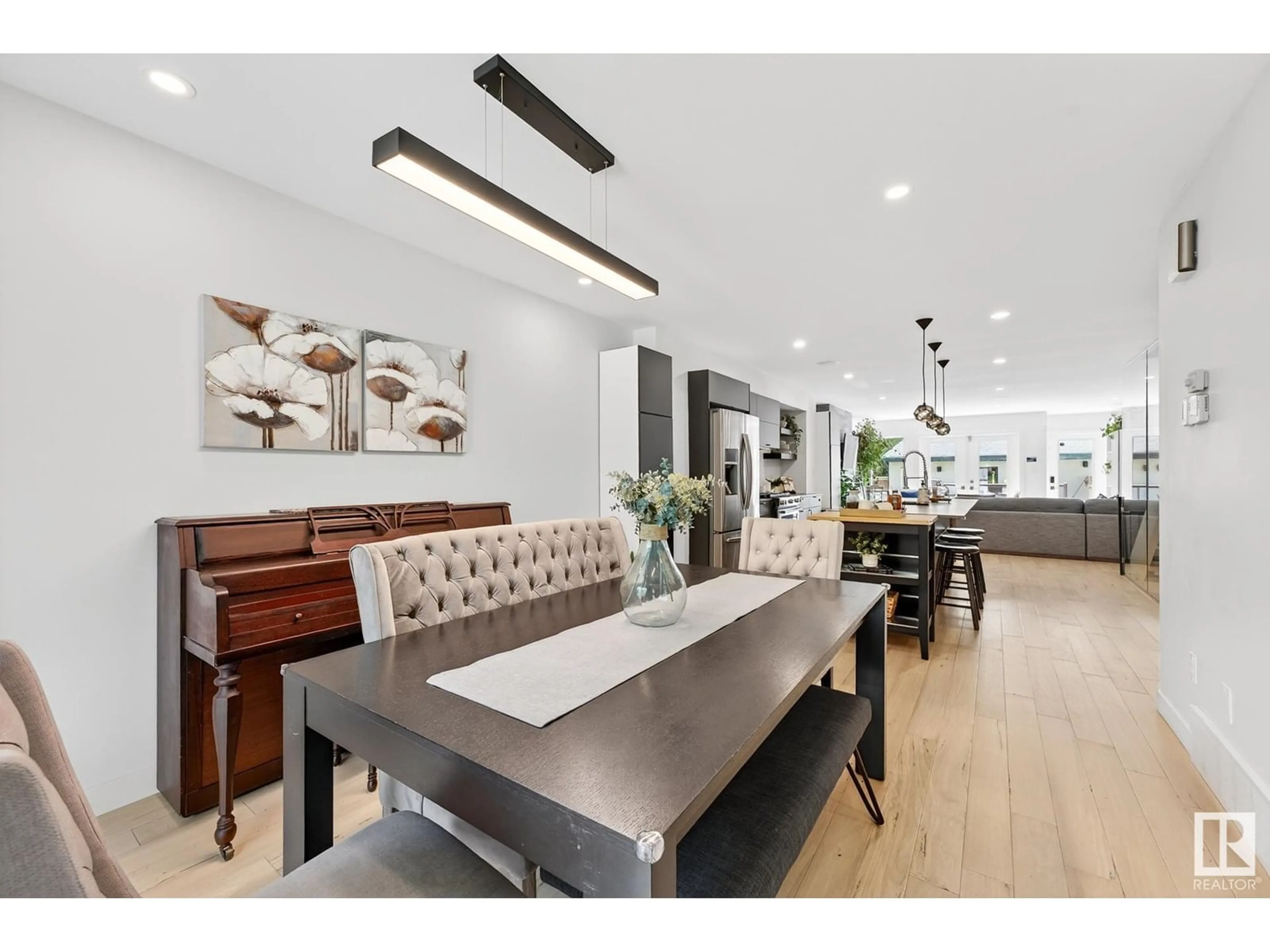 Open concept kitchen, wood/laminate floor for 10811 64 AVE, Edmonton Alberta T6H1T3