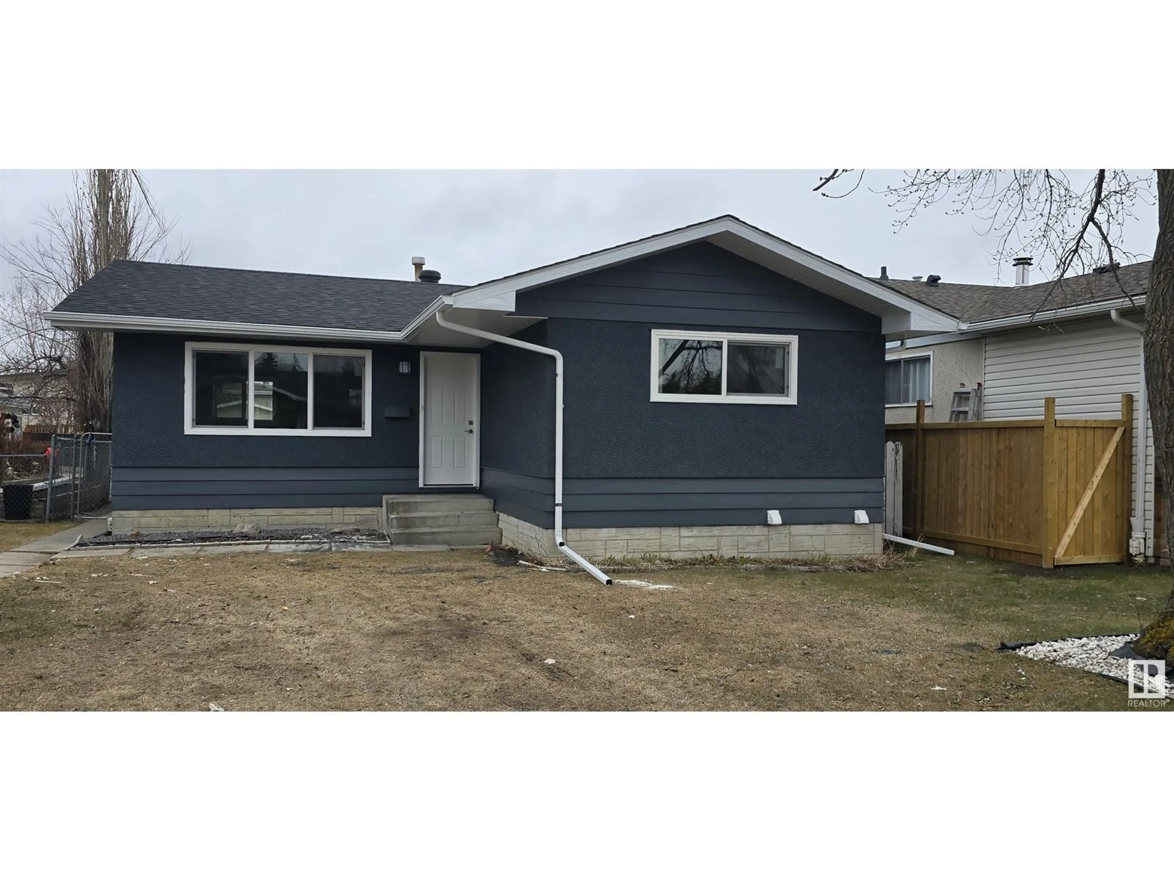 Home with vinyl exterior material, street for 14807 95A ST NW, Edmonton Alberta T5E4A5