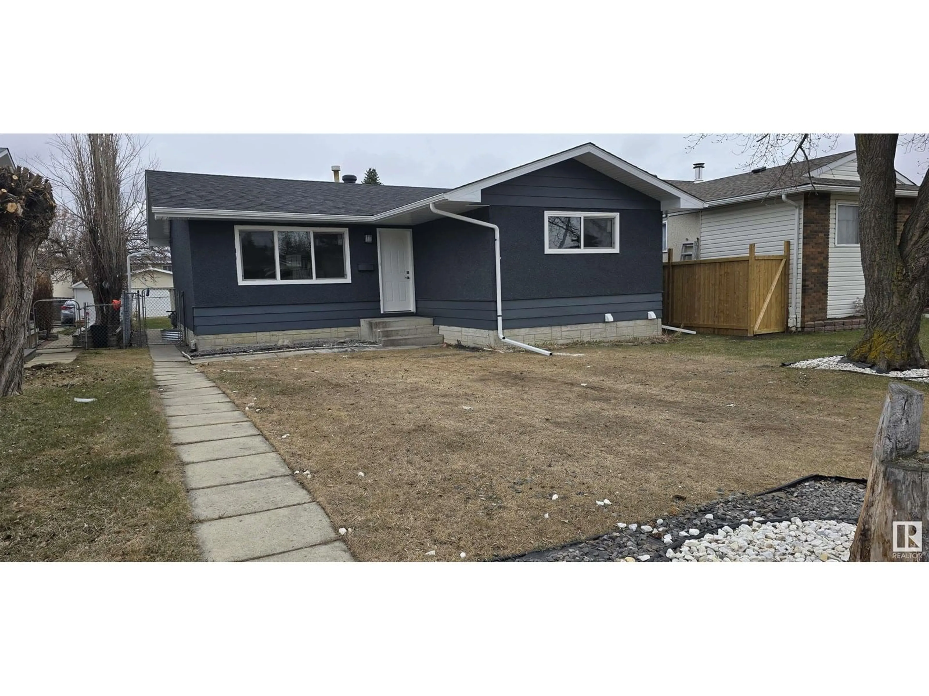Home with vinyl exterior material, street for 14807 95A ST NW, Edmonton Alberta T5E4A5