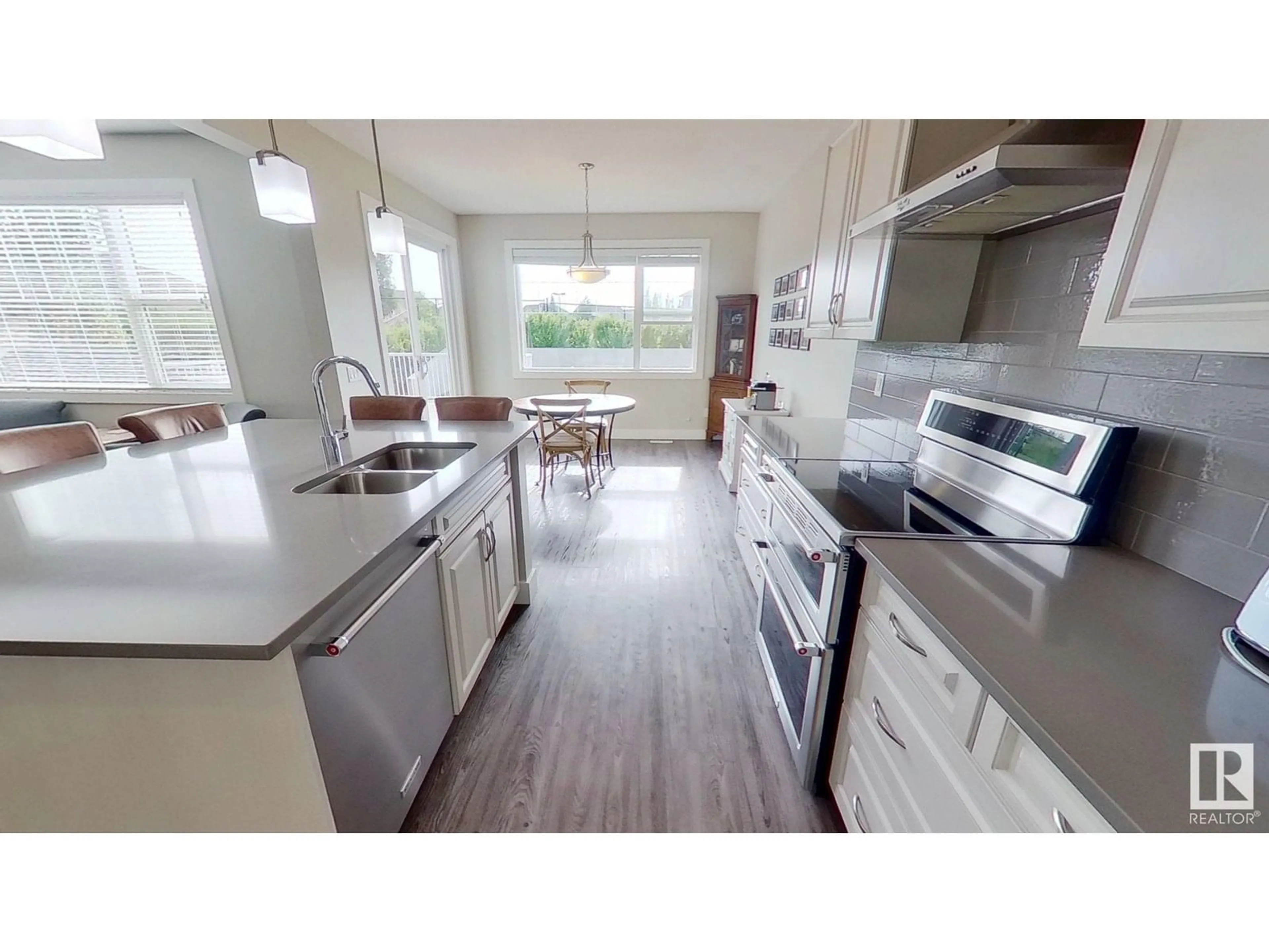 Open concept kitchen, wood/laminate floor for 104 ALDRIDGE CR, Sherwood Park Alberta T8H0Y2