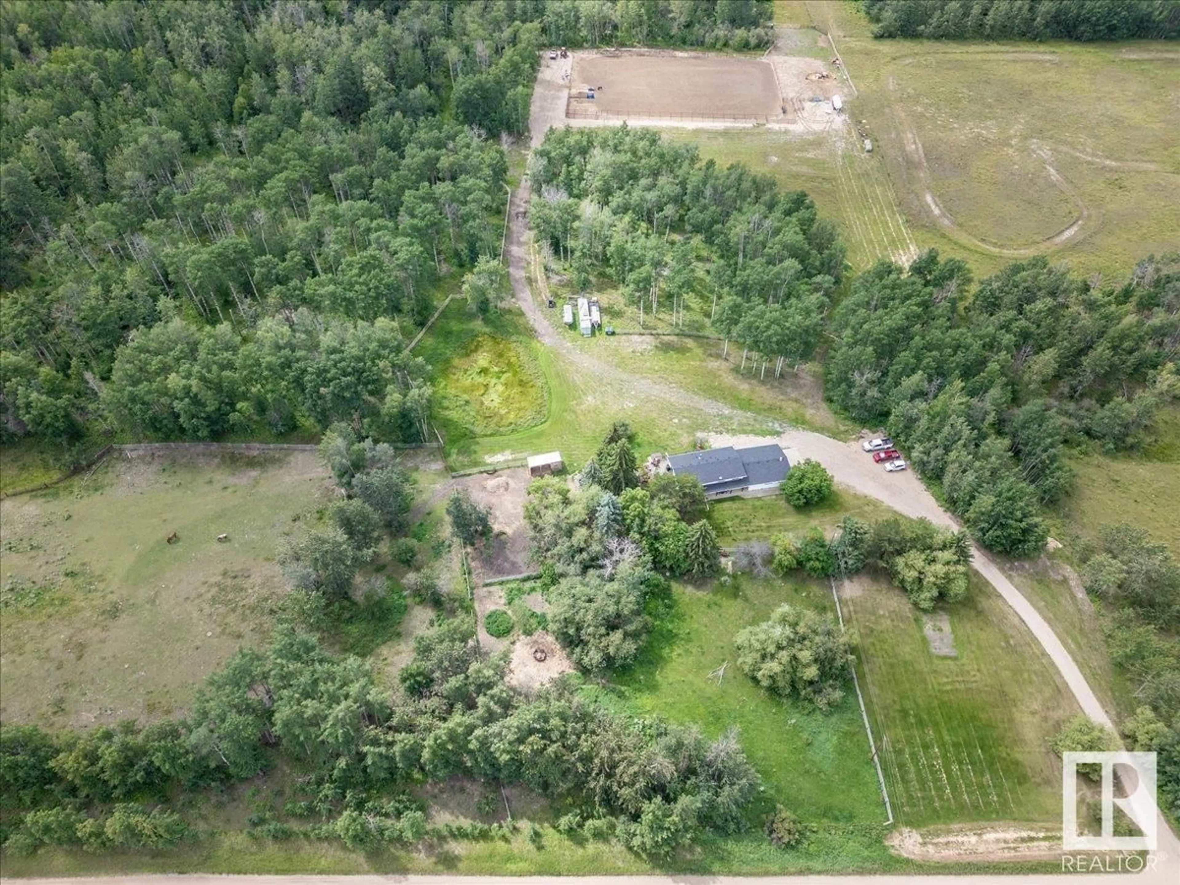 A pic from outside/outdoor area/front of a property/back of a property/a pic from drone, forest/trees view for 48240 RGE ROAD 275, Rural Leduc County Alberta T0C0V0