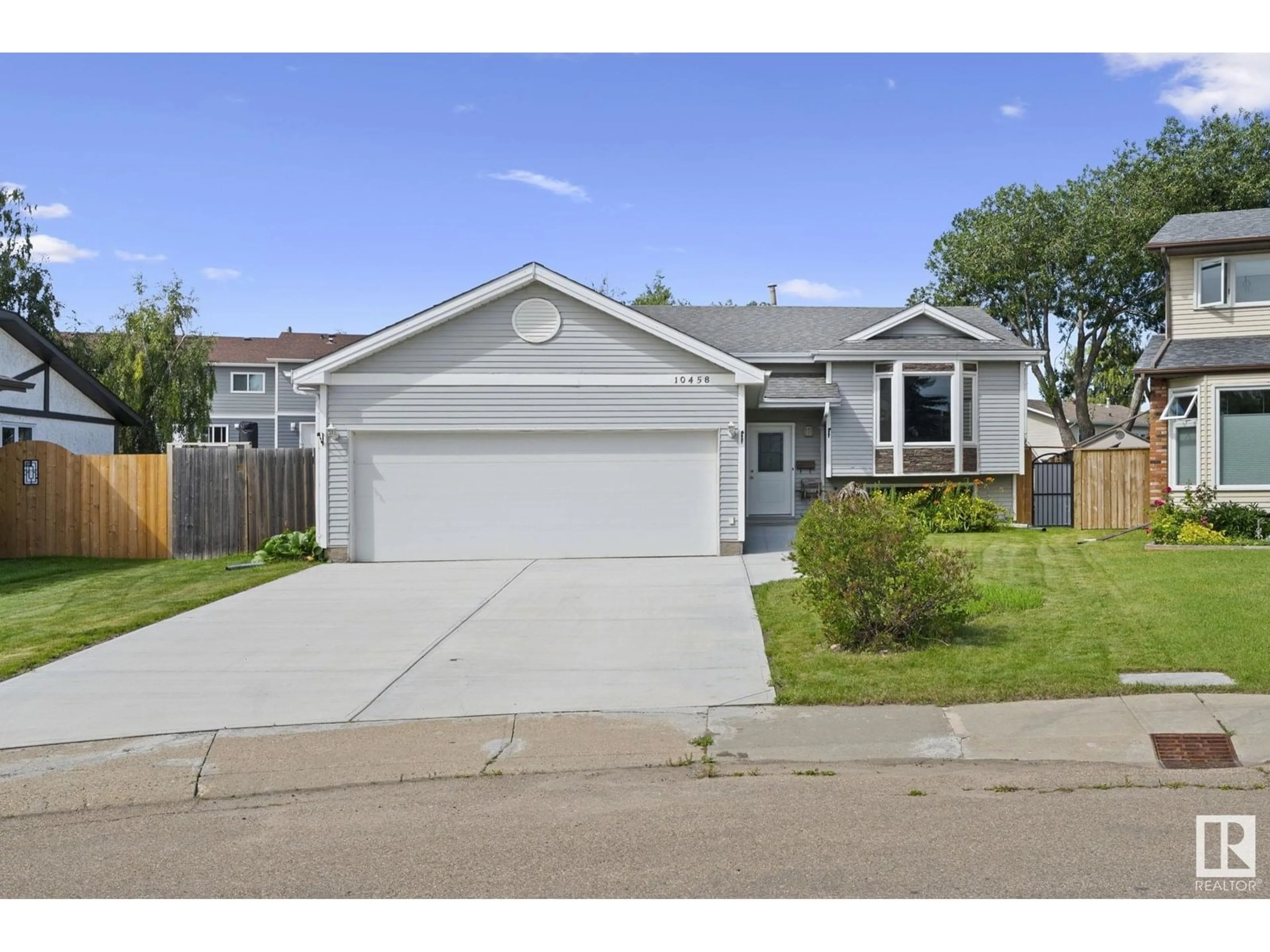 Home with vinyl exterior material, street for NW - 10458 14 AV, Edmonton Alberta T6J5S9