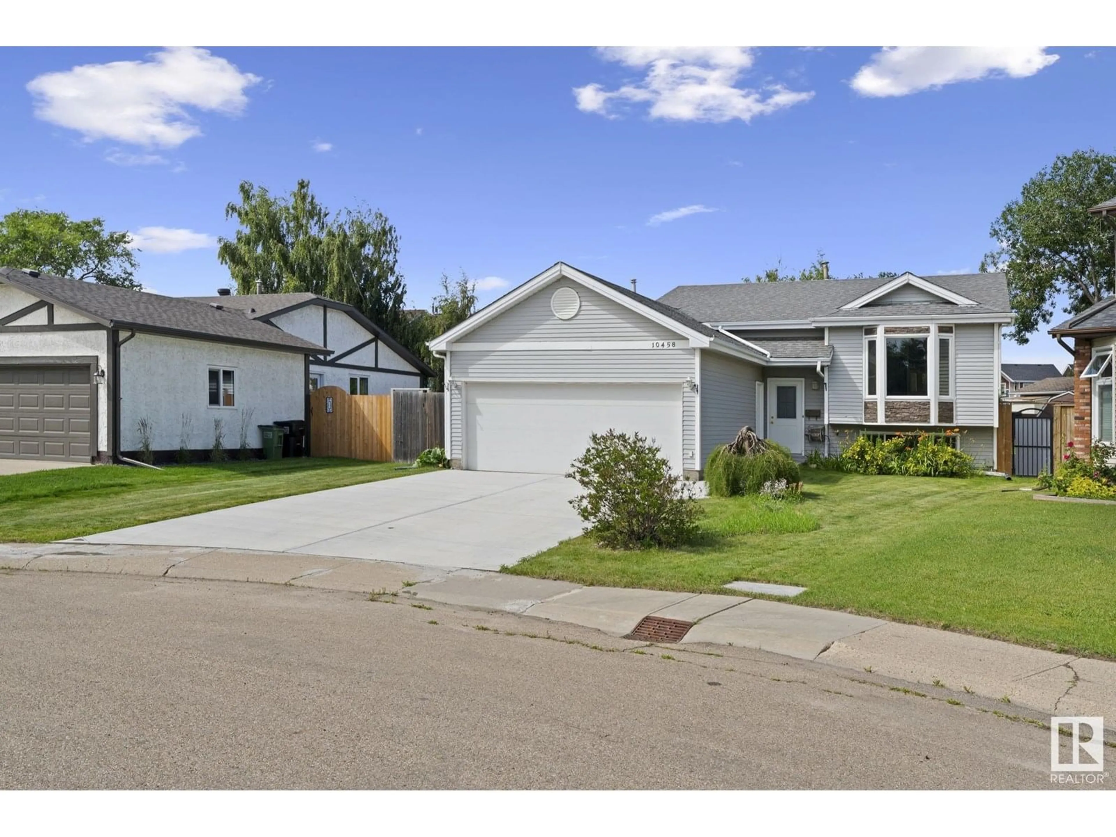 Home with vinyl exterior material, street for NW - 10458 14 AV, Edmonton Alberta T6J5S9