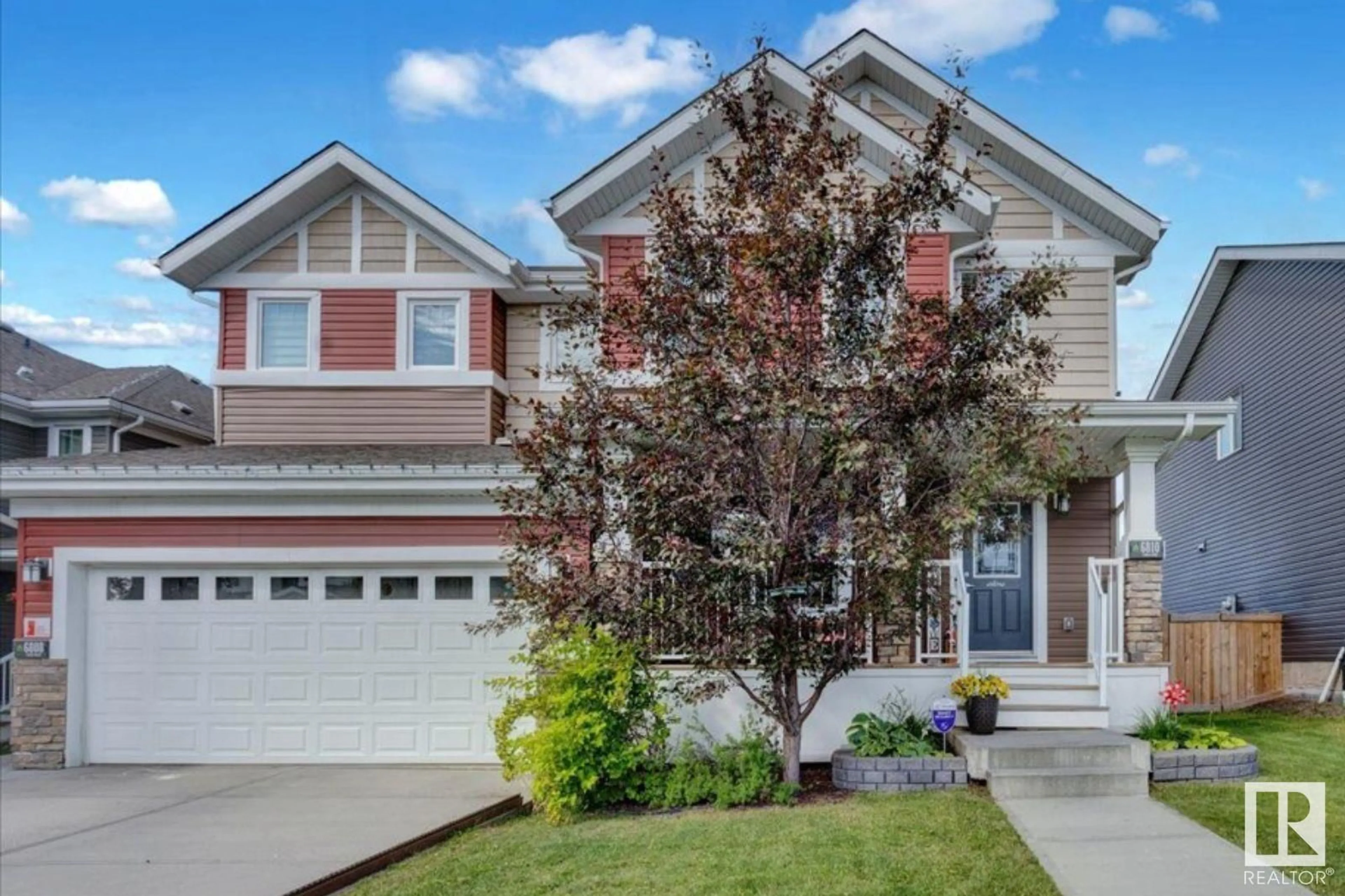 Home with vinyl exterior material, street for 6810 EVANS WD, Edmonton Alberta T6M0T3