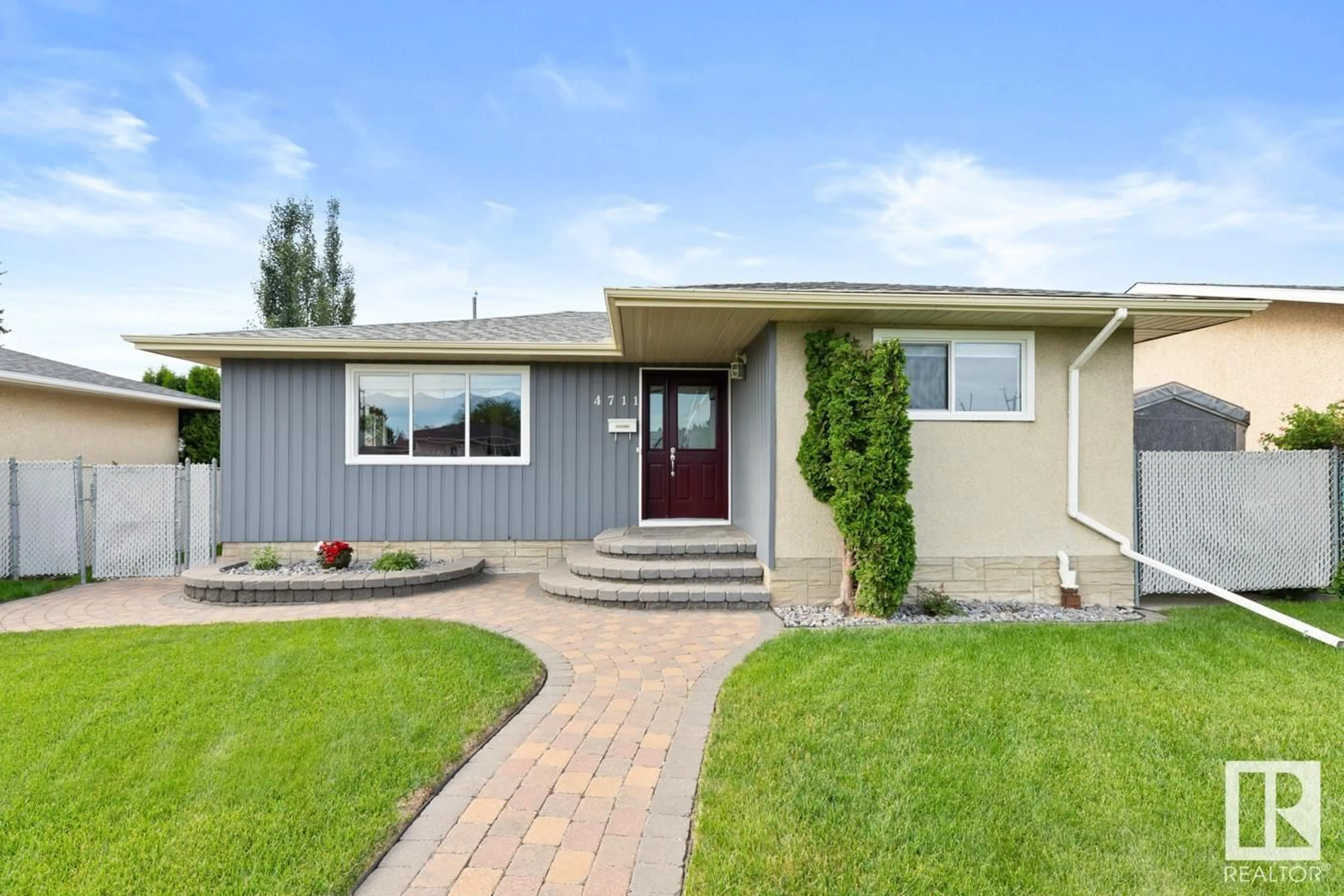 Home with vinyl exterior material, street for 4711 102A AV, Edmonton Alberta T6A0P9