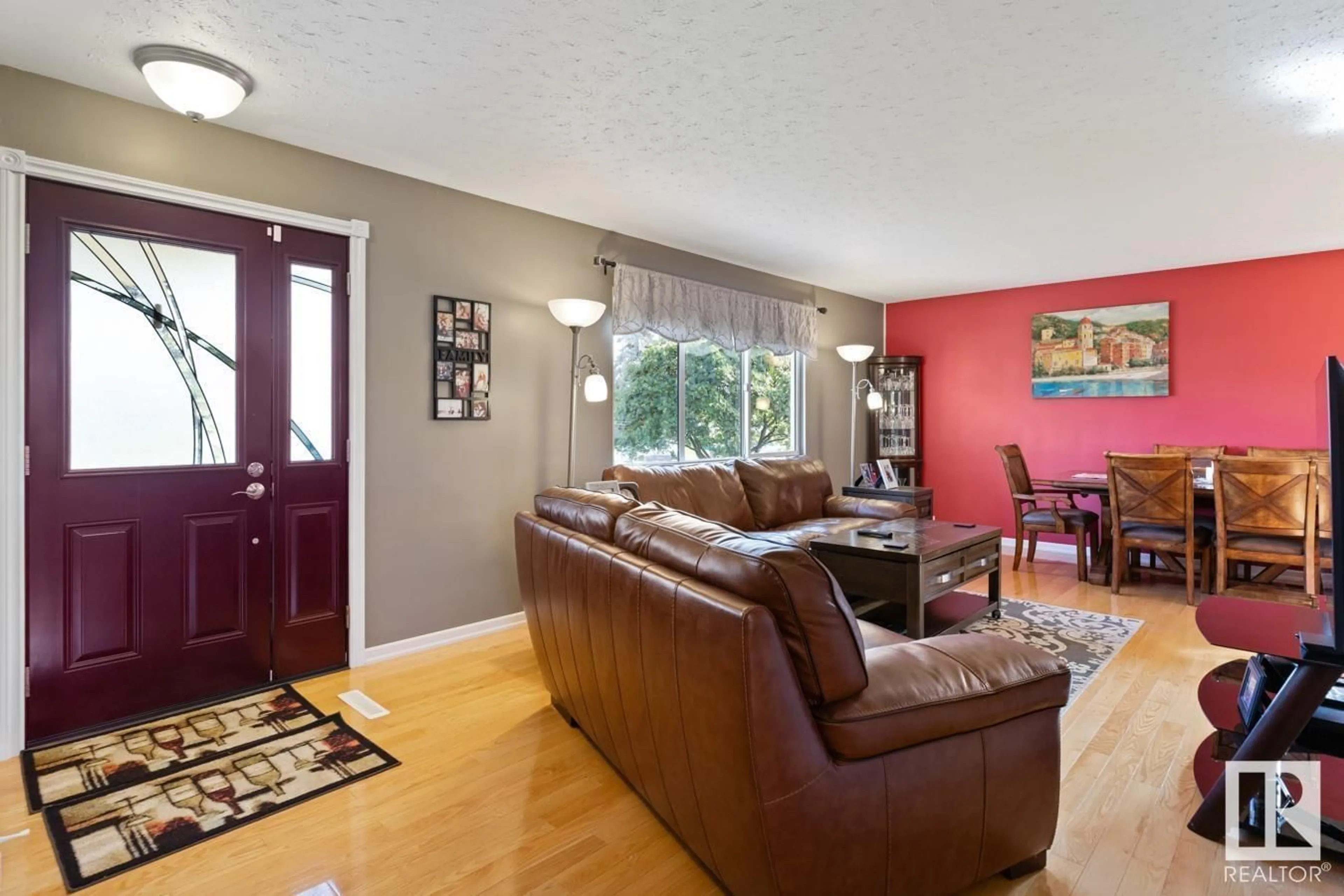 Living room with furniture, wood/laminate floor for 4711 102A AV, Edmonton Alberta T6A0P9