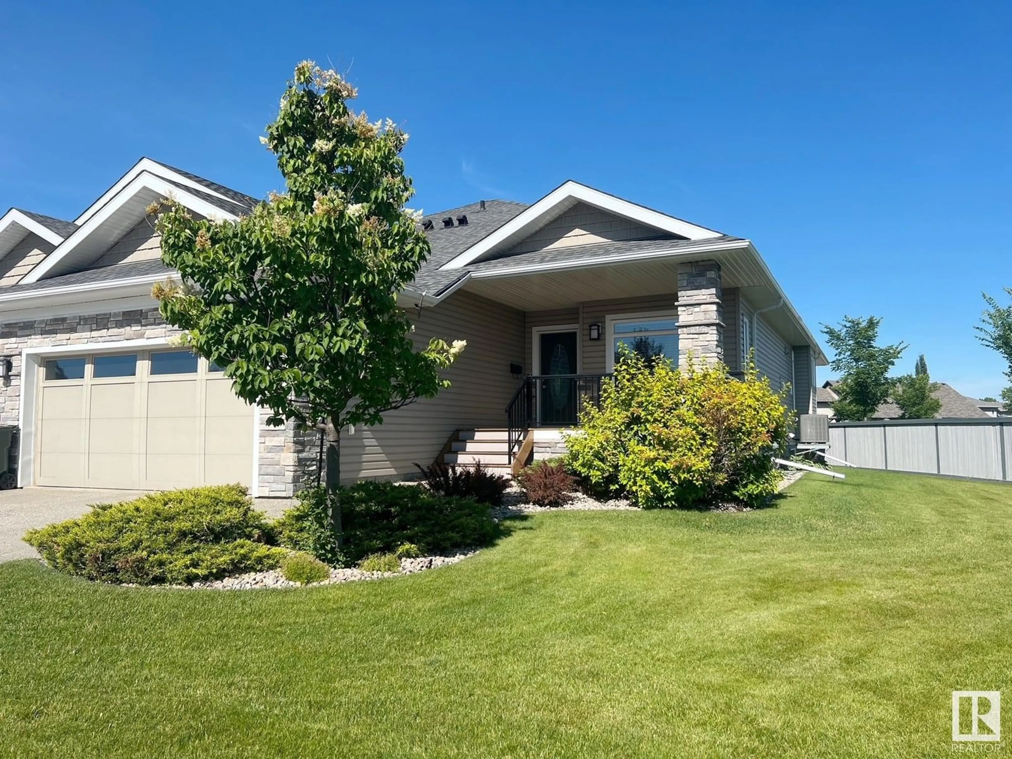 Home with vinyl exterior material, street for 1 LINCOLN CV, Spruce Grove Alberta T7X0N5
