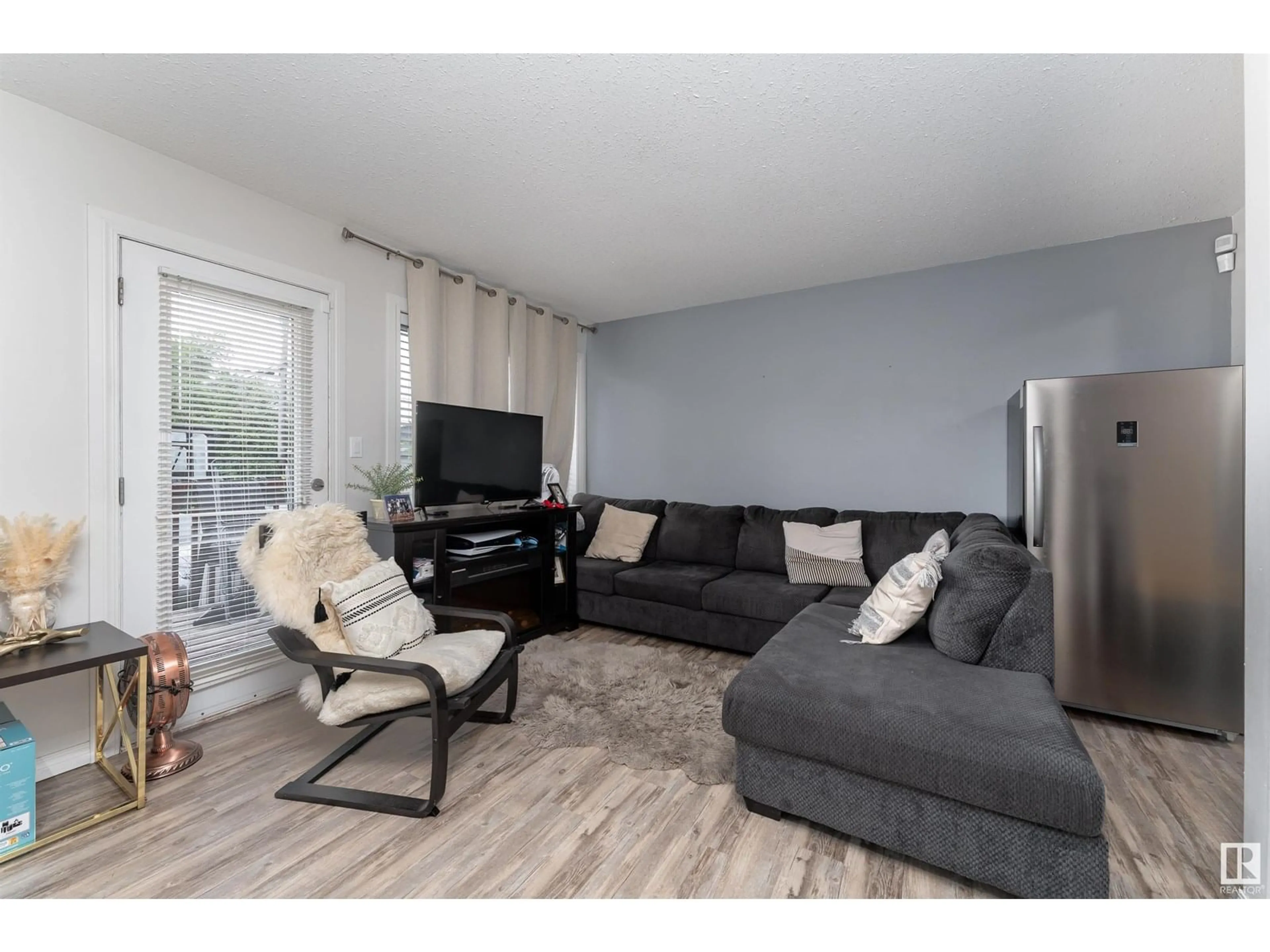 Living room with furniture, wood/laminate floor for #2 - 11813 43 ST NW, Edmonton Alberta T5W2P3