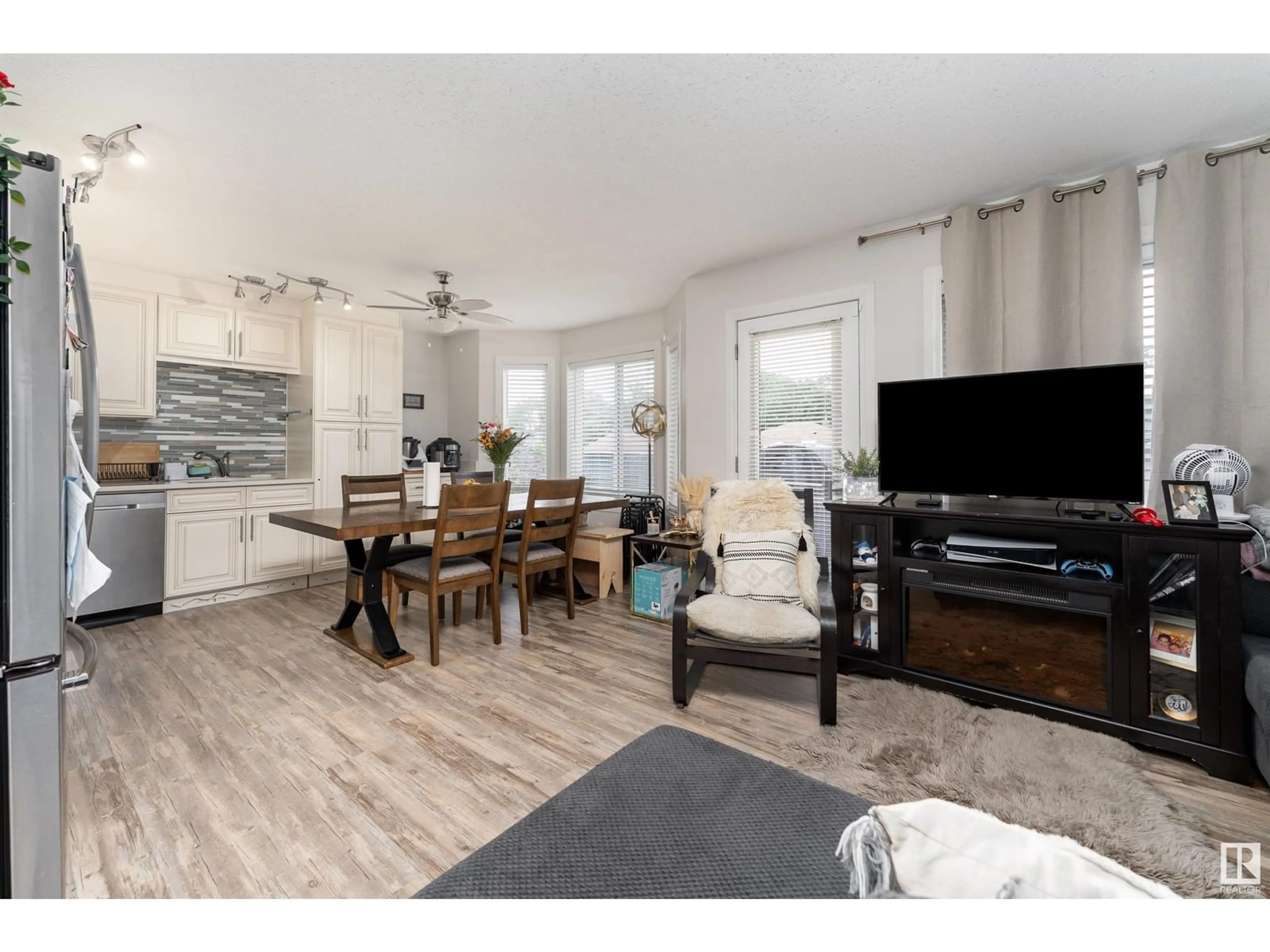 Living room with furniture, wood/laminate floor for #2 - 11813 43 ST NW, Edmonton Alberta T5W2P3