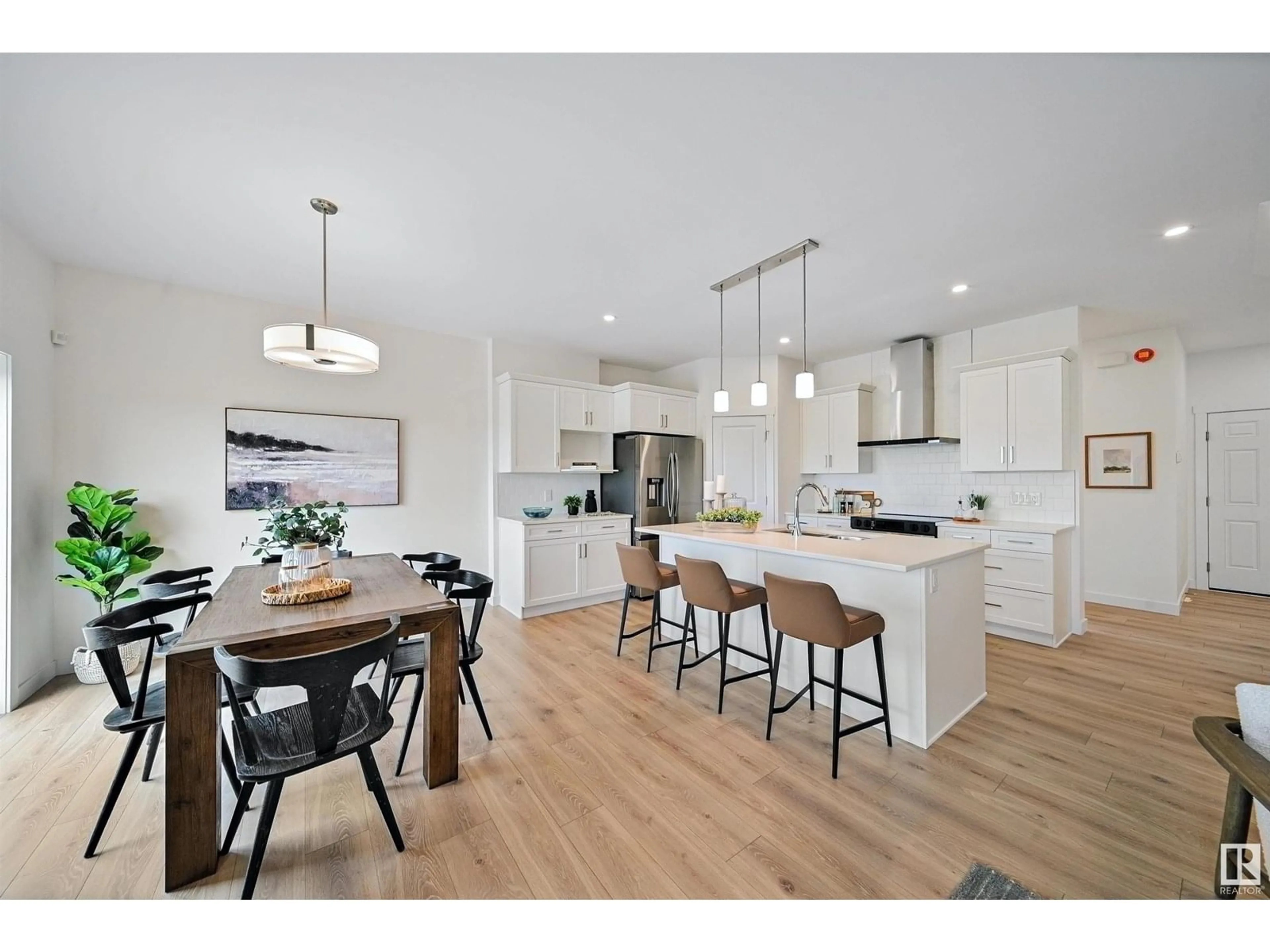 Open concept kitchen, wood/laminate floor for 4023 208 ST, Edmonton Alberta T6M3E4