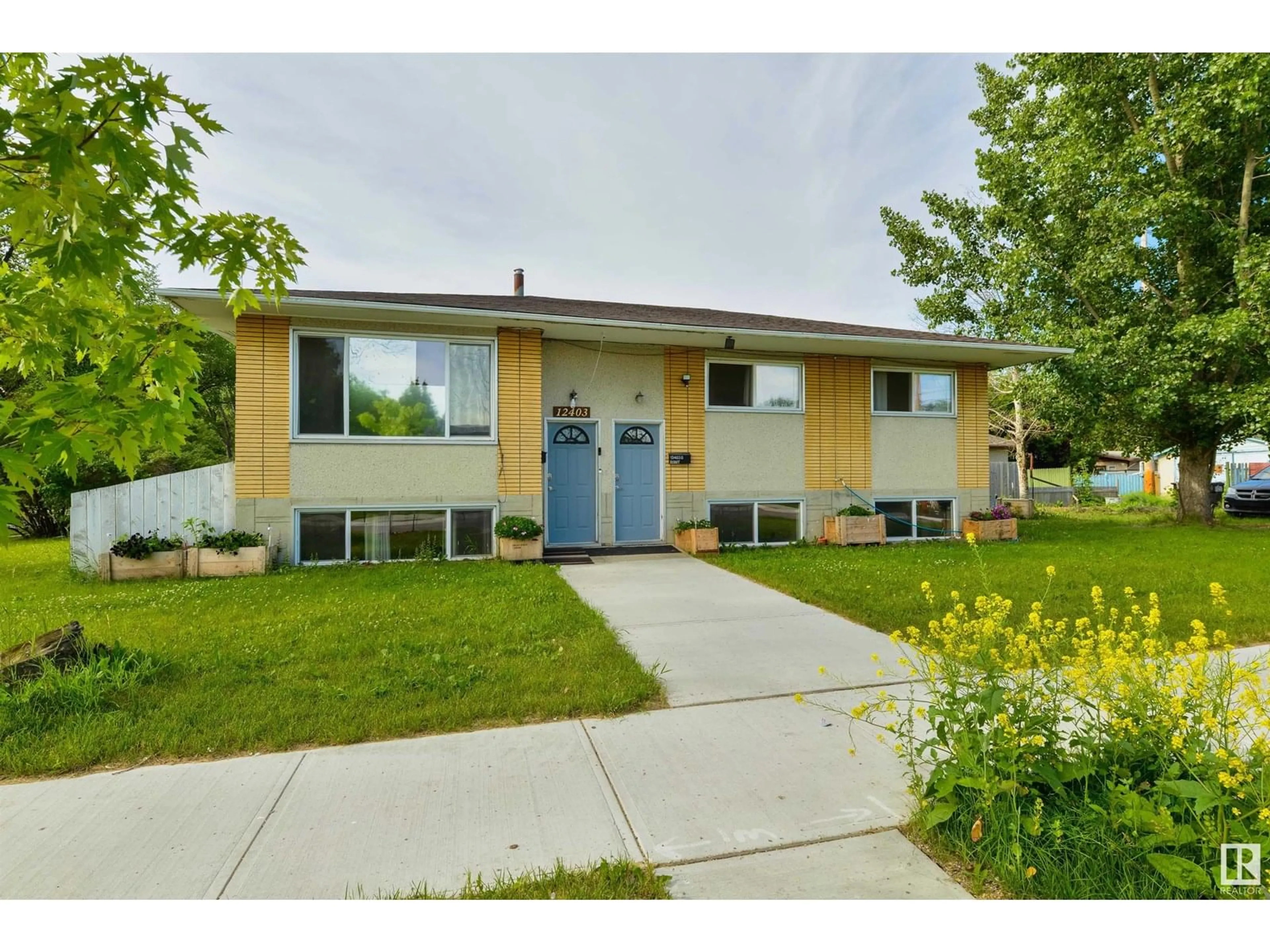 Home with vinyl exterior material, street for NW - 12403 130 AV, Edmonton Alberta T5L3K9