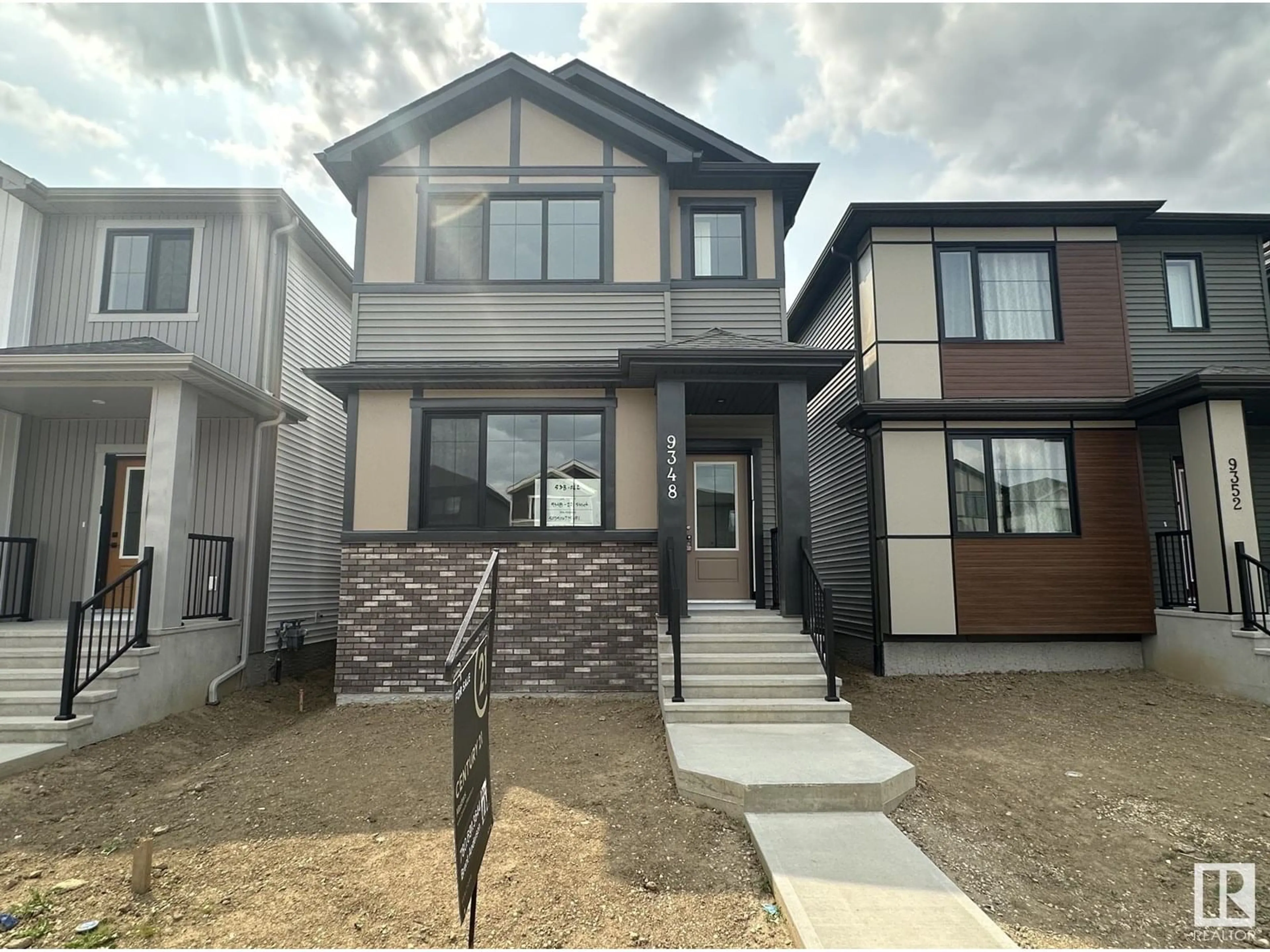 Home with vinyl exterior material, street for NW - 9348 221 ST, Edmonton Alberta T5T6C9