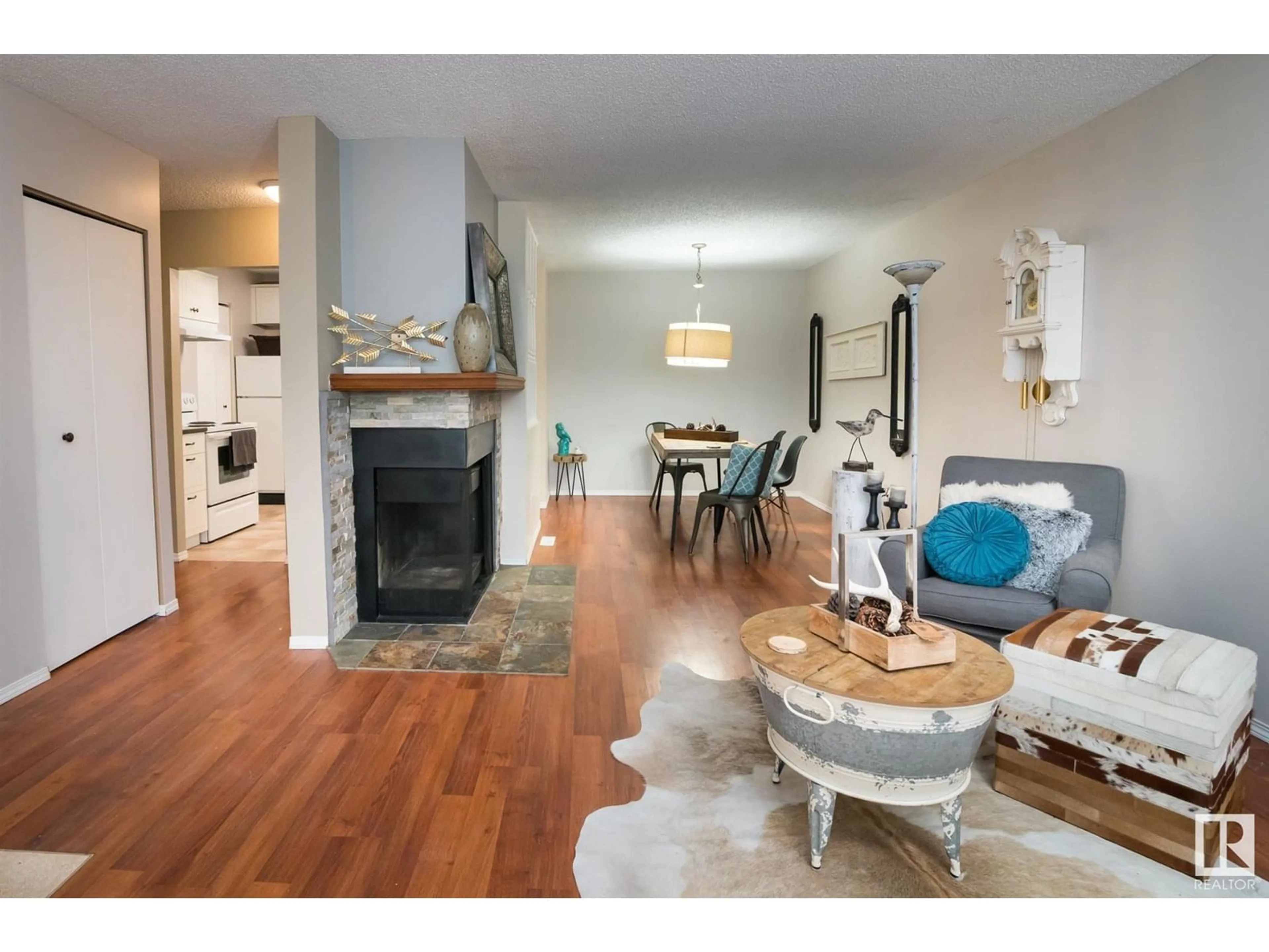 Living room with furniture, wood/laminate floor for 173 - 2703 79 ST NW, Edmonton Alberta T6K3Z6