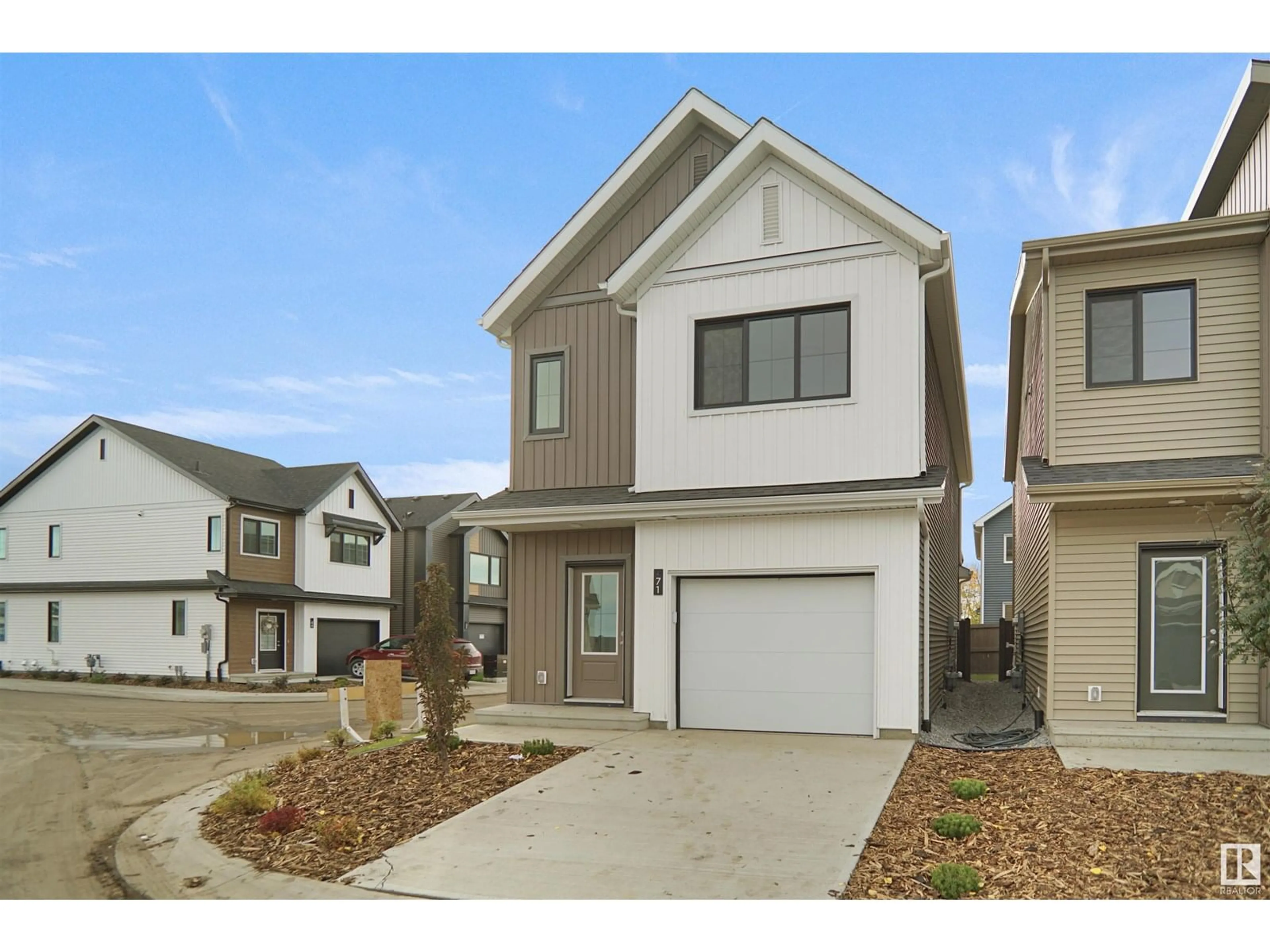 Home with vinyl exterior material, street for 62 19904 31 AV NW, Edmonton Alberta T6M1N7