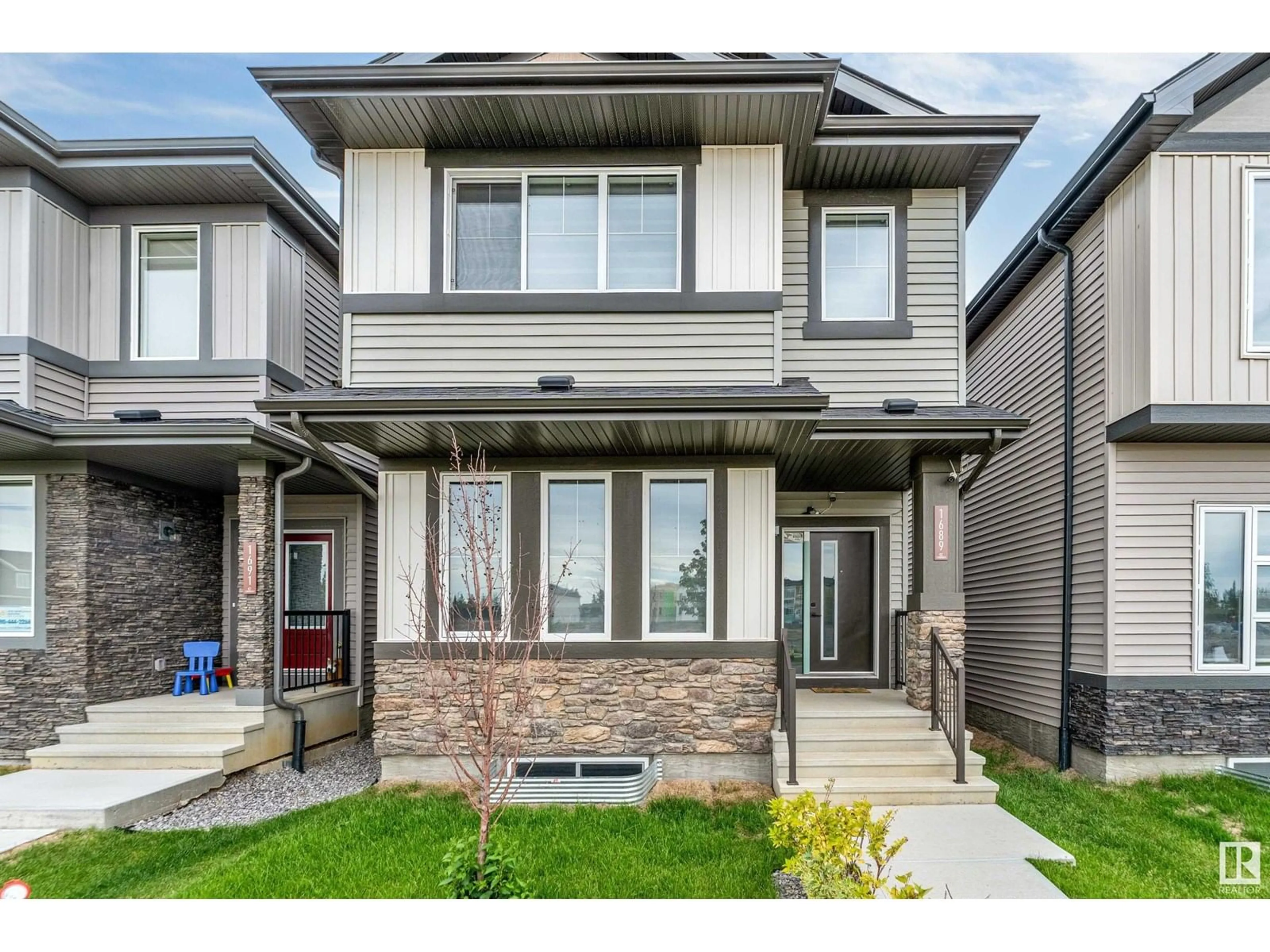 Home with vinyl exterior material, street for 1689 CAVANAGH BV, Edmonton Alberta T6W4S6