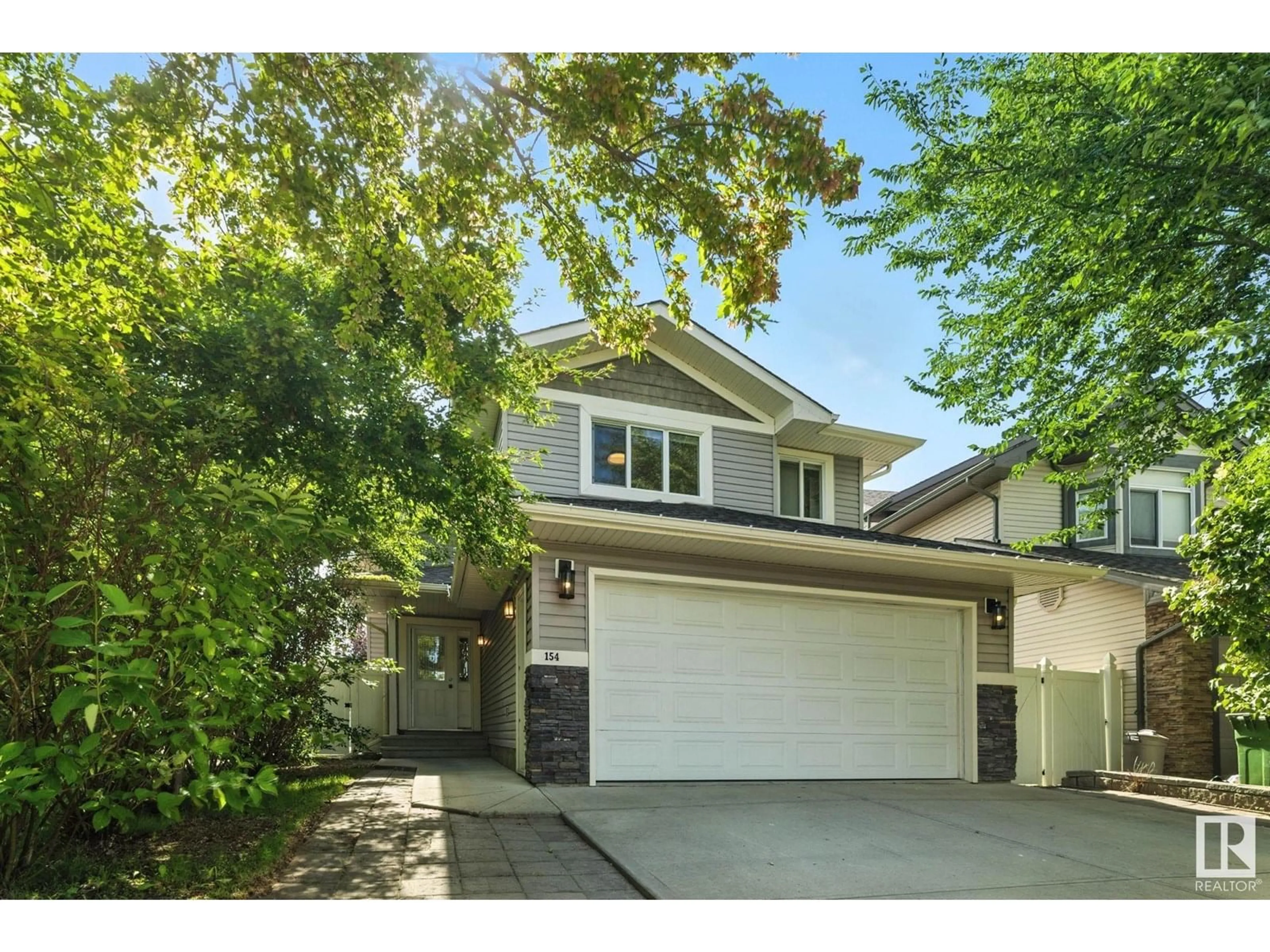 Home with vinyl exterior material, street for 154 WELLINGTON PLACE, Fort Saskatchewan Alberta T8L0G4