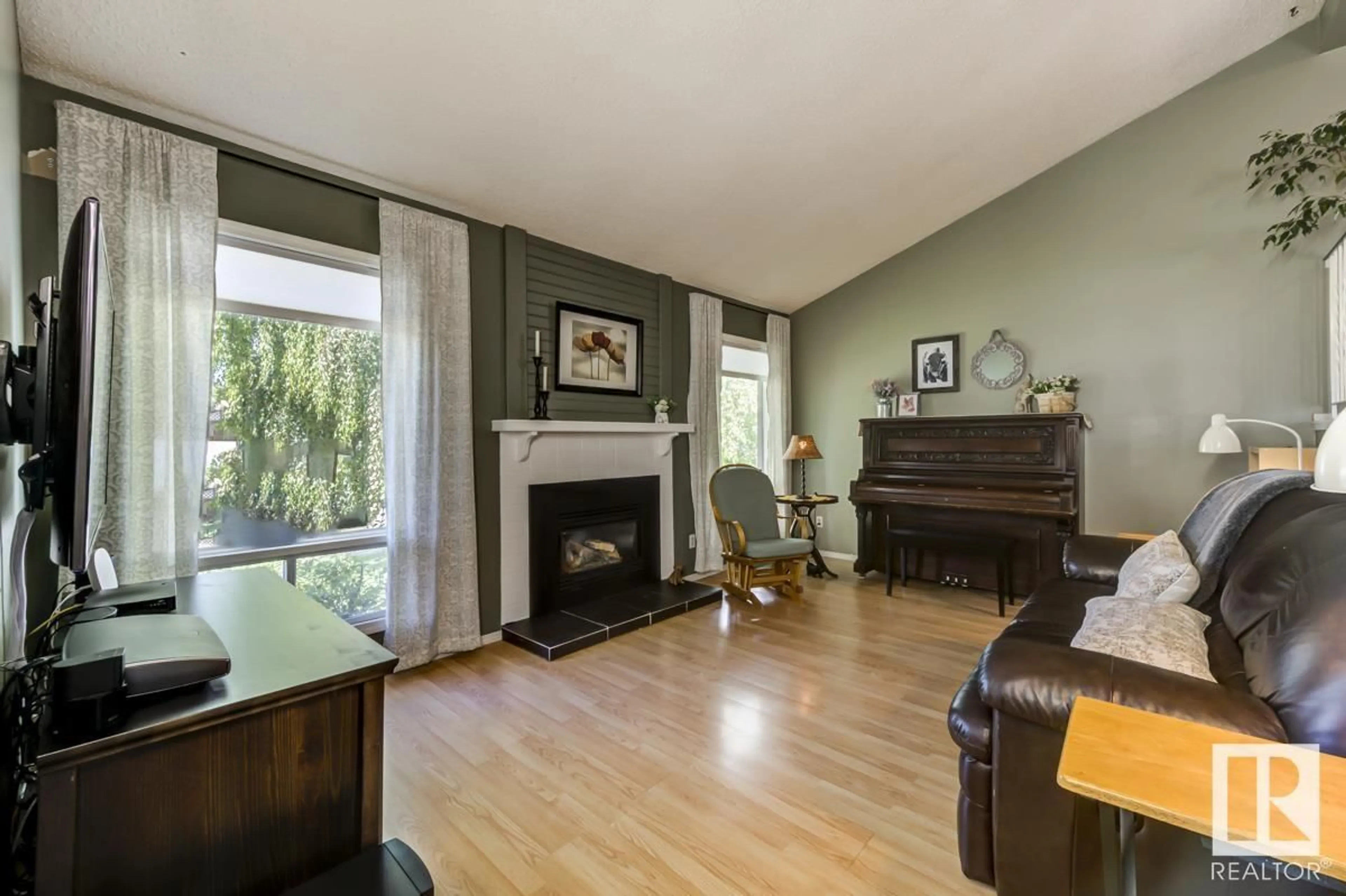 Living room with furniture, wood/laminate floor for 456 KIRKPATRICK CR, Edmonton Alberta T6L5E1