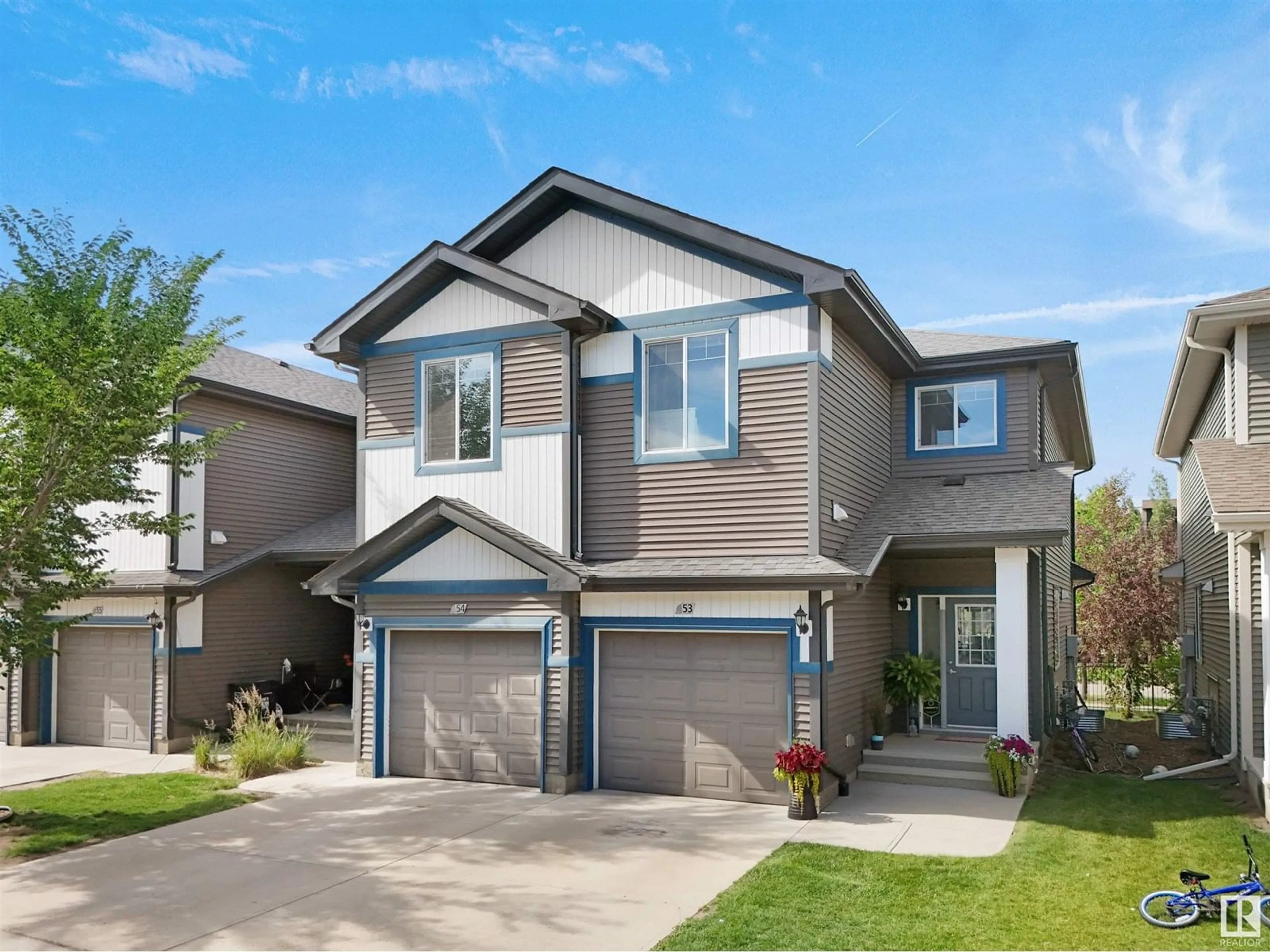 Home with vinyl exterior material, street for 53 8209 217 STREET, Edmonton Alberta T5T6Z4