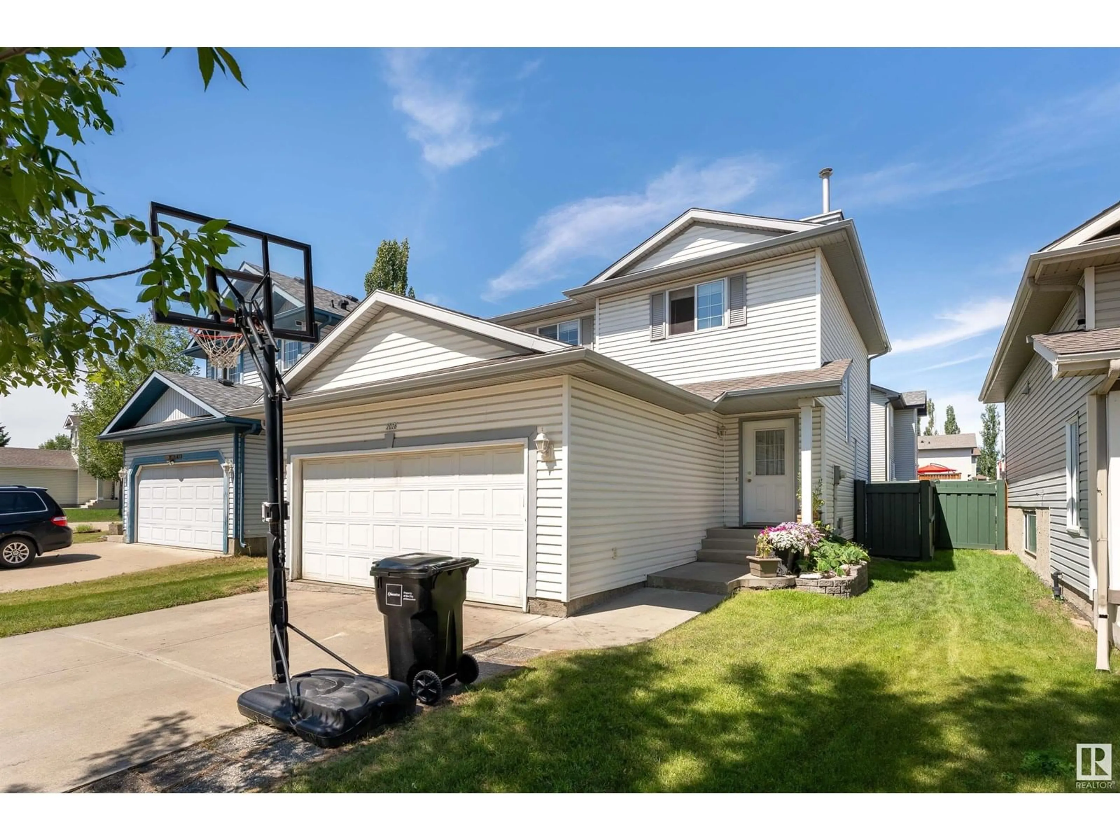Home with vinyl exterior material, street for 2026 GARNETT WY, Edmonton Alberta T5T6R1