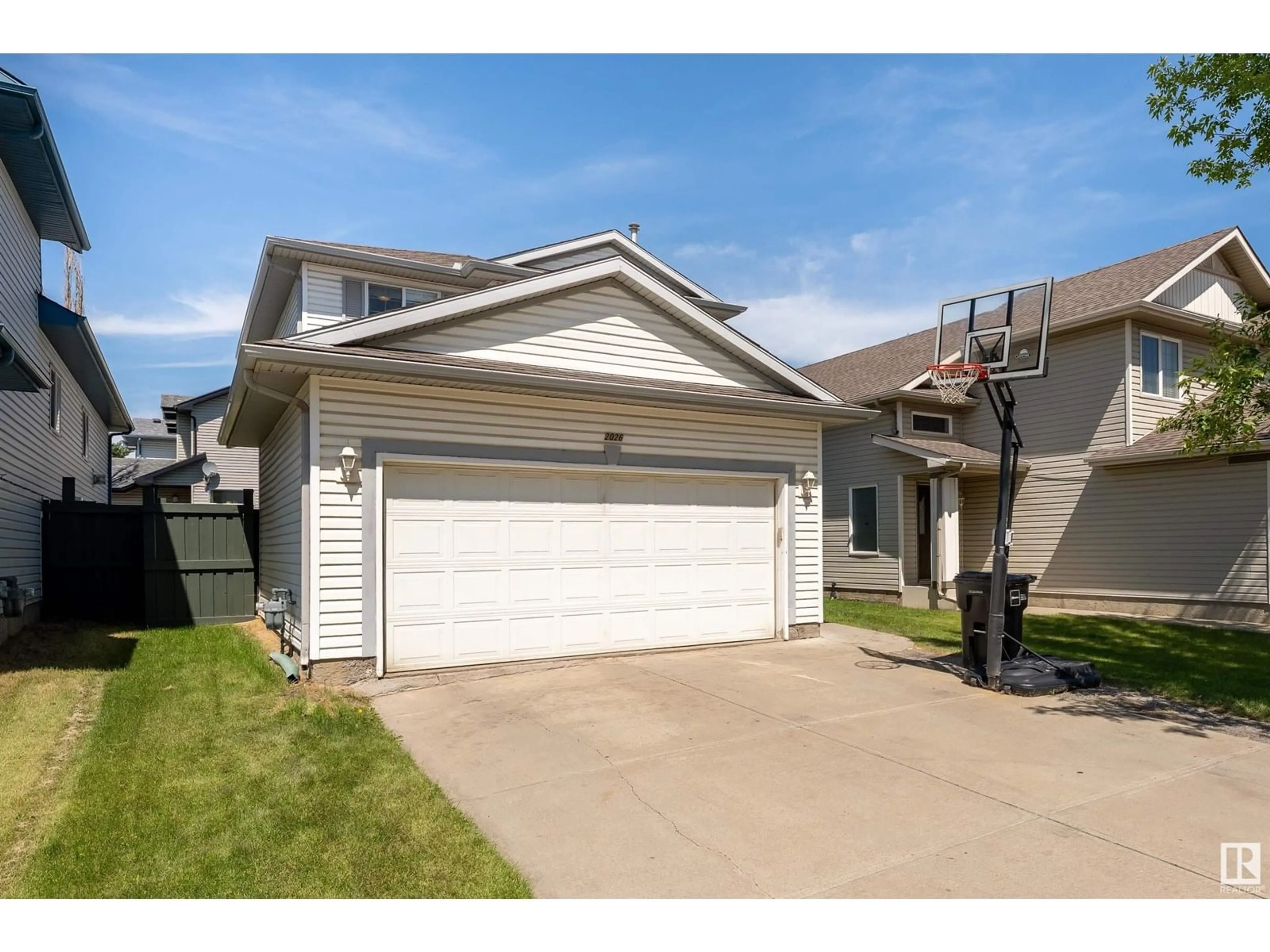 Home with vinyl exterior material, street for 2026 GARNETT WY, Edmonton Alberta T5T6R1