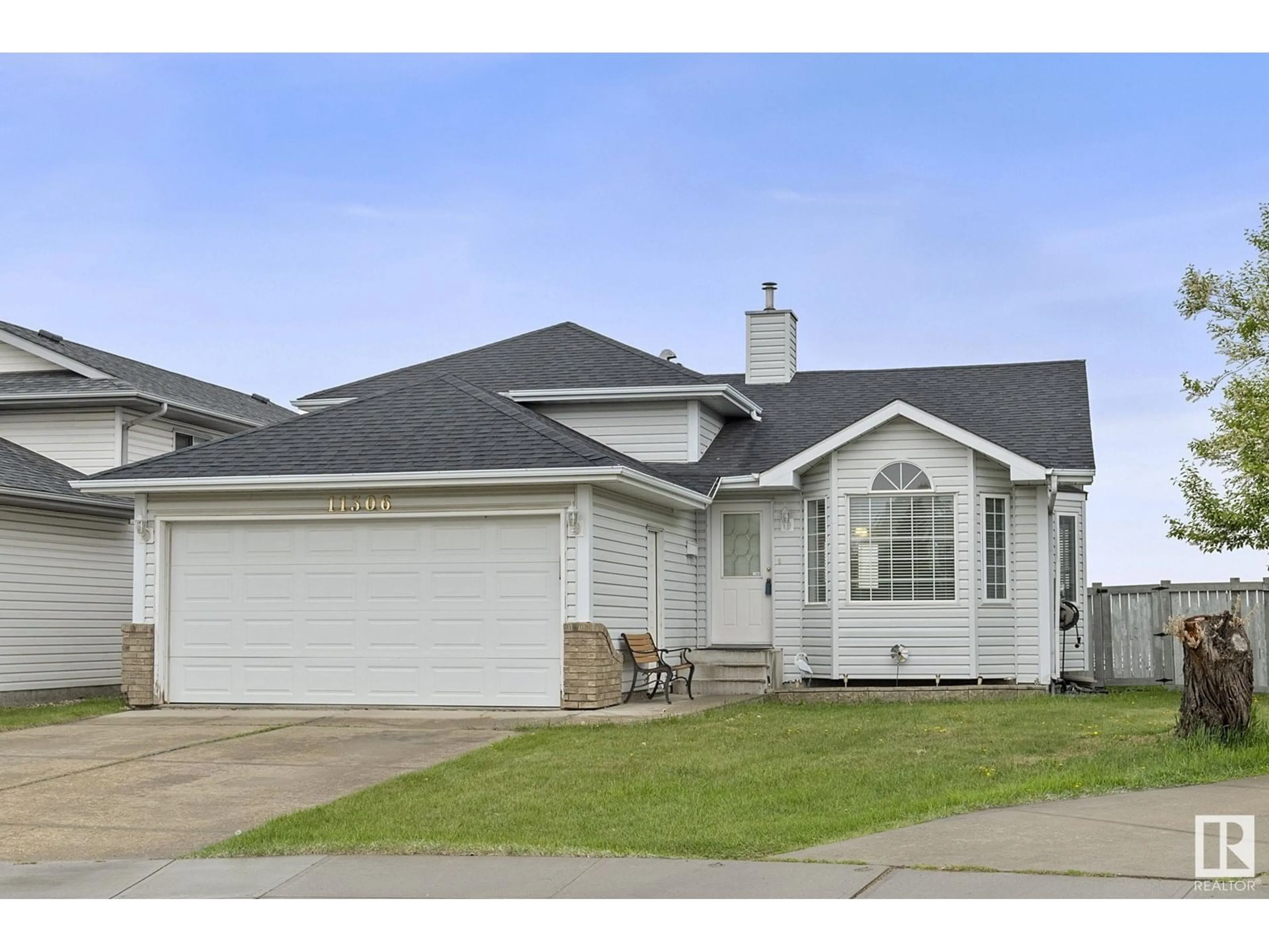 Home with vinyl exterior material, street for 11306 173 AV NW, Edmonton Alberta T5X4Y4