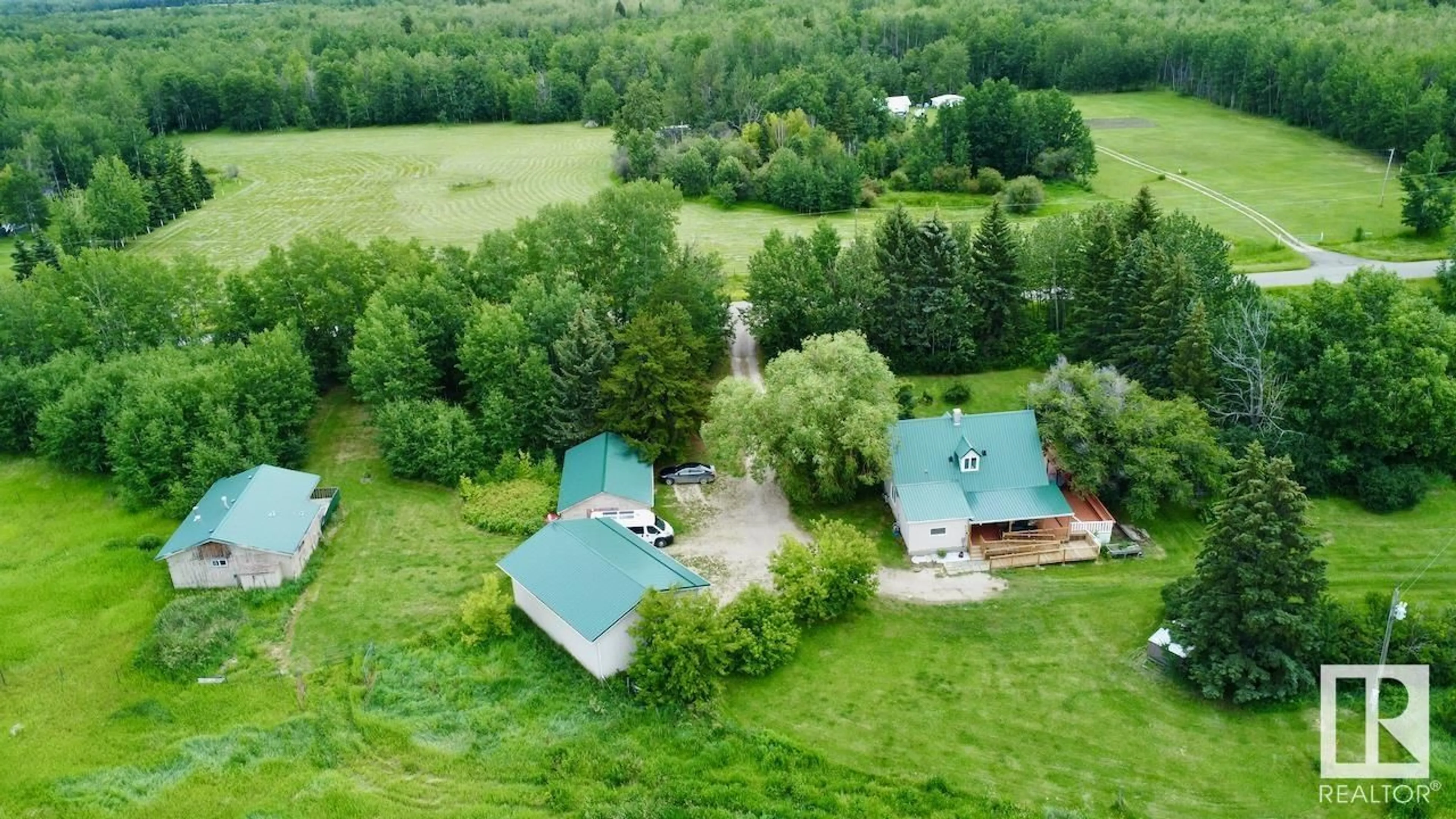 A pic from outside/outdoor area/front of a property/back of a property/a pic from drone, forest/trees view for 53320 RGE ROAD 55, Rural Parkland County Alberta T0E0V0