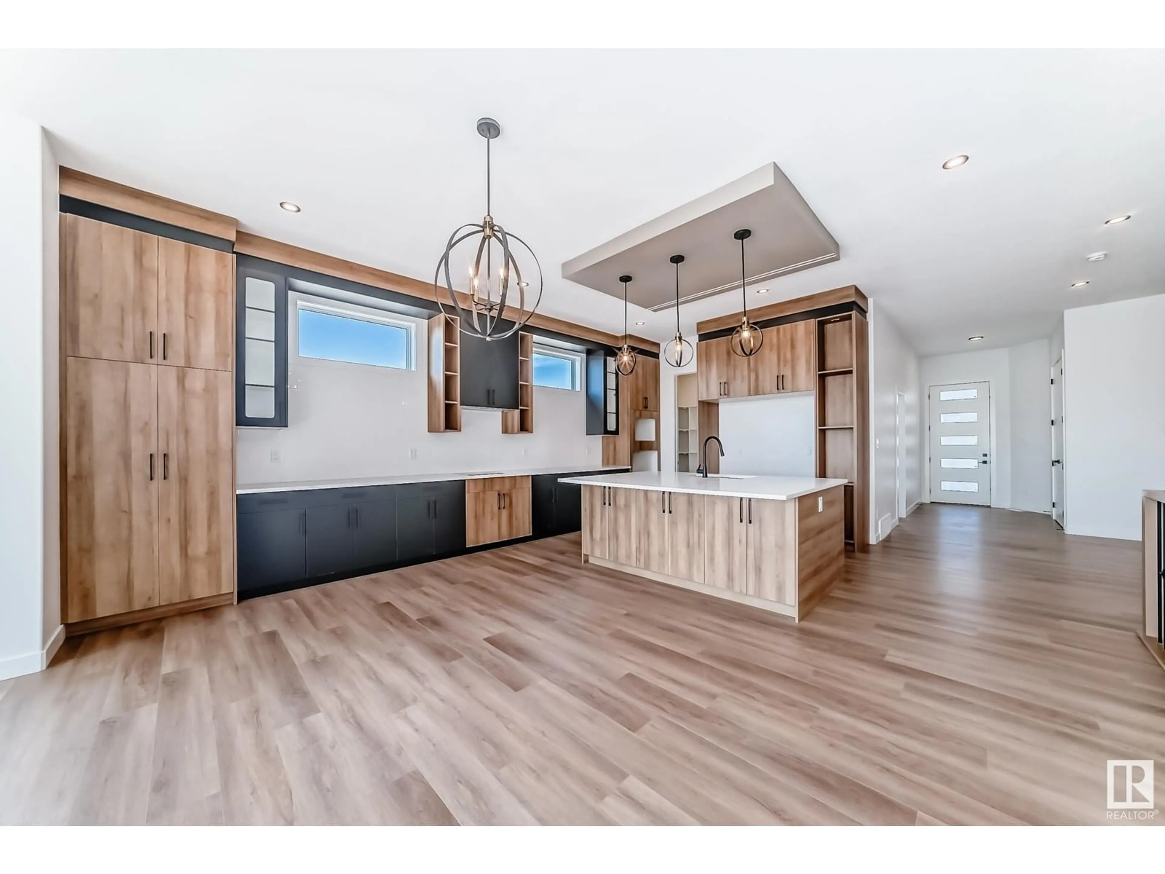 Open concept kitchen, wood/laminate floor for 201 BASIN, Leduc Alberta T9E1M9